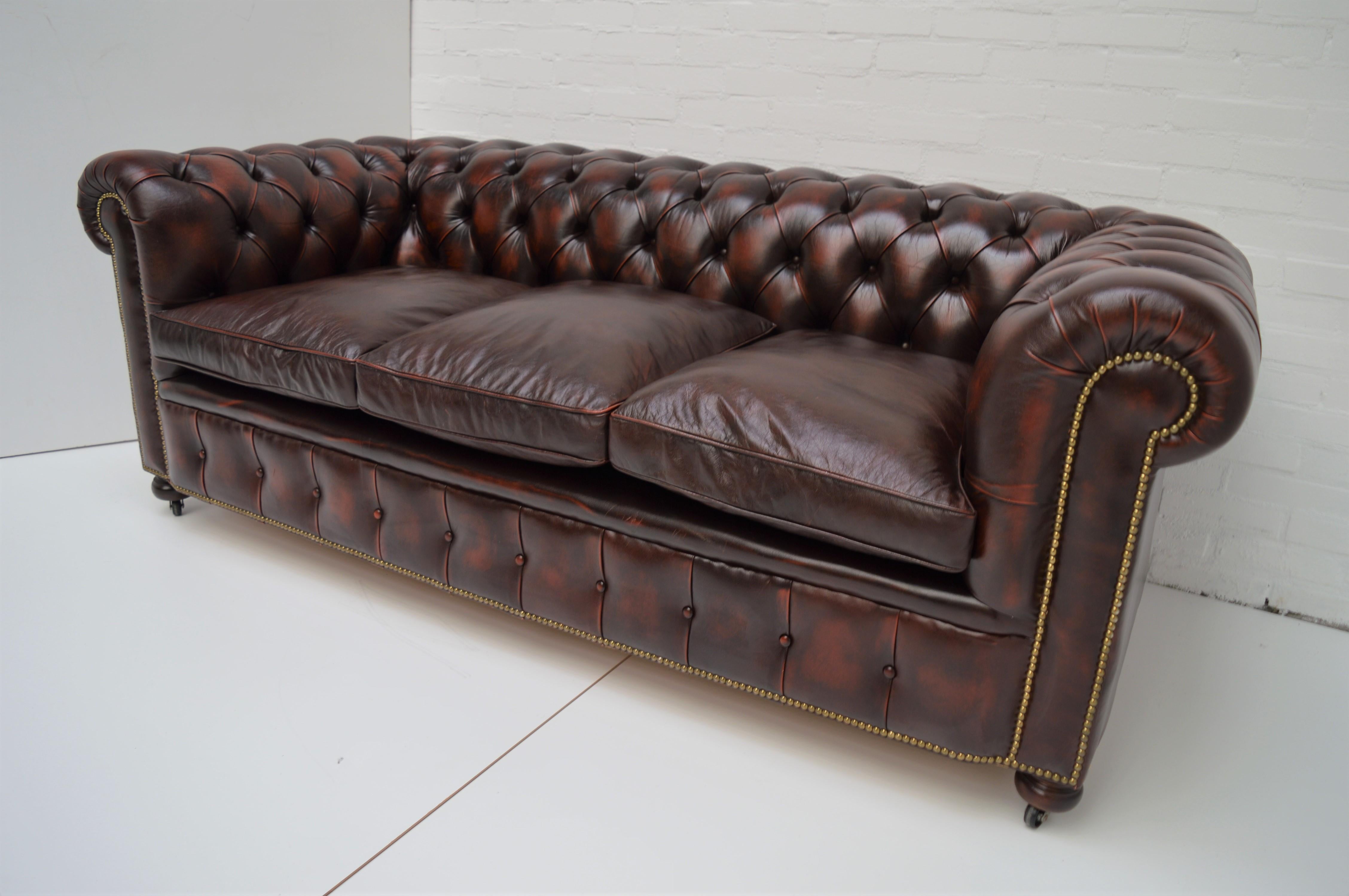 Antique Tan Chesterfield Sofa with Brass Castors / Wheels In Good Condition For Sale In Eindhoven, NL