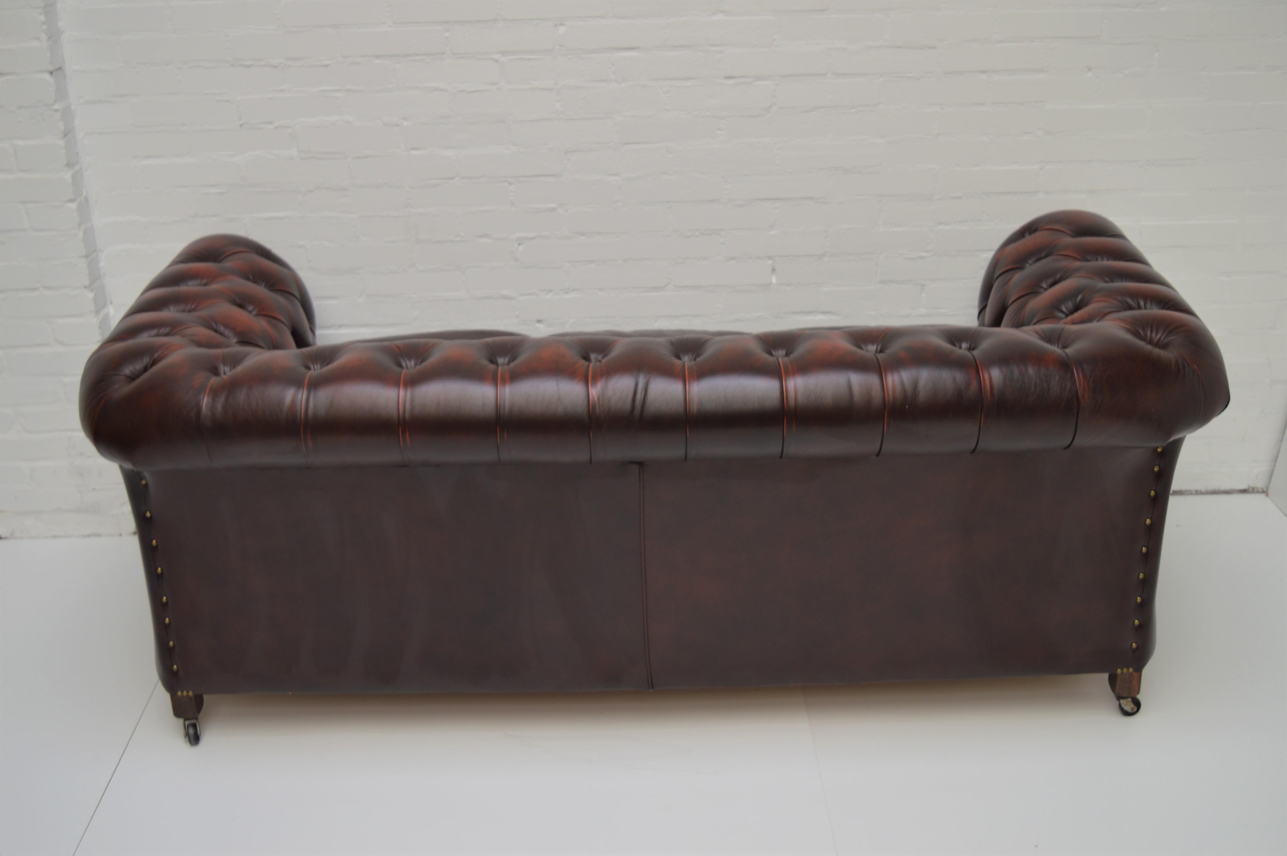 Antique Tan Chesterfield Sofa with Brass Castors / Wheels For Sale 2
