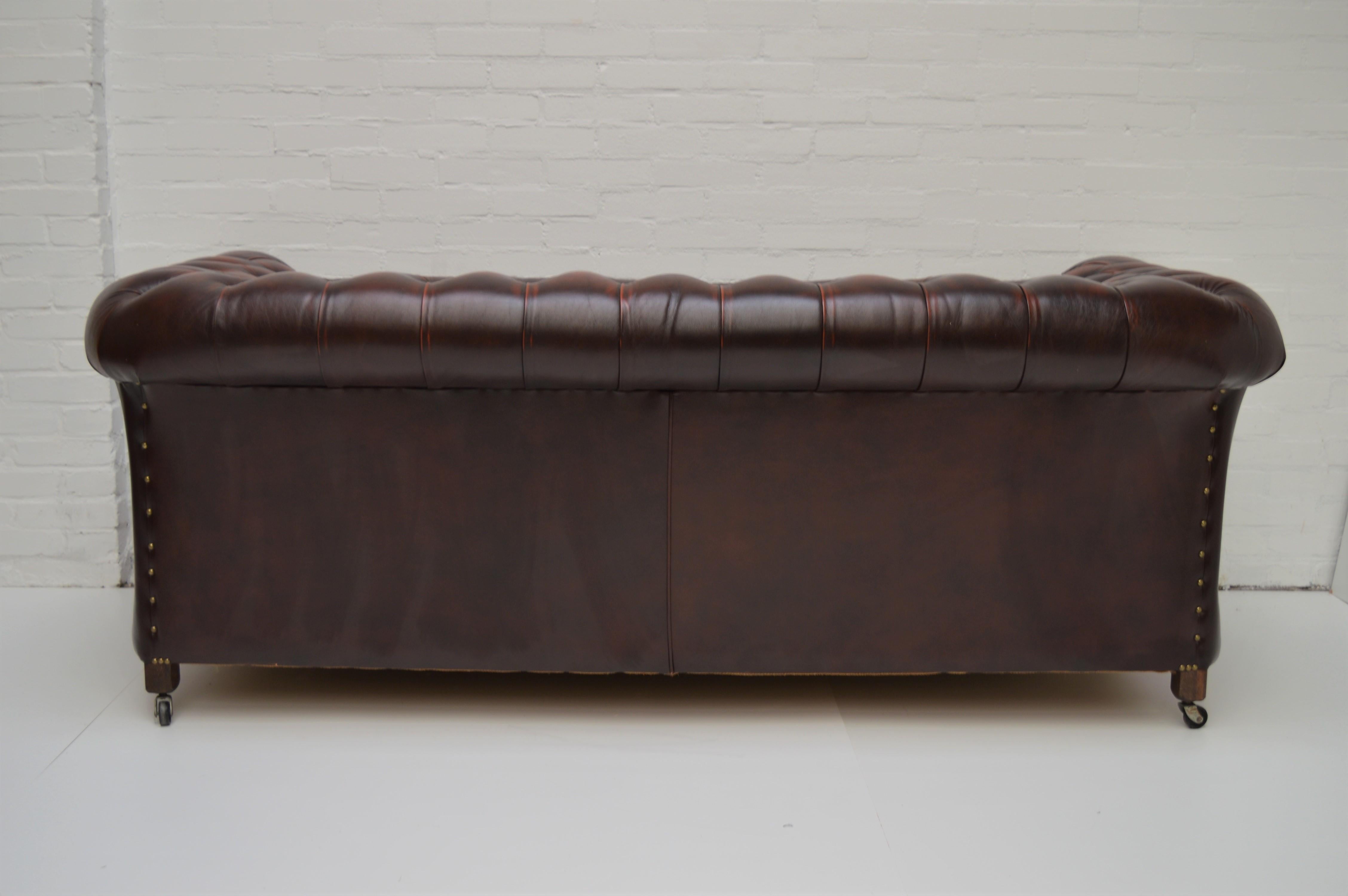 Antique Tan Chesterfield Sofa with Brass Castors / Wheels For Sale 3