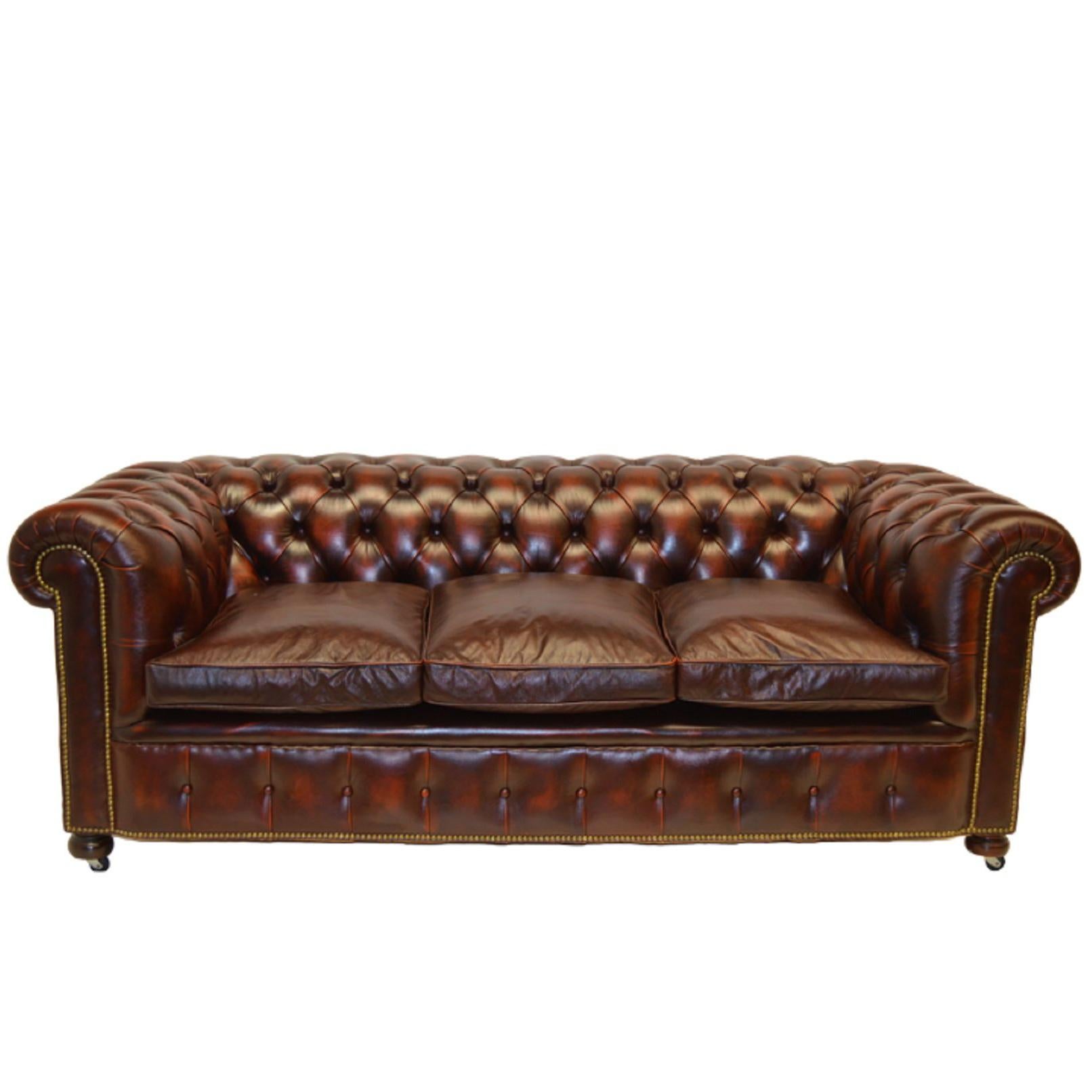 Antique Tan Chesterfield Sofa with Brass Castors / Wheels For Sale