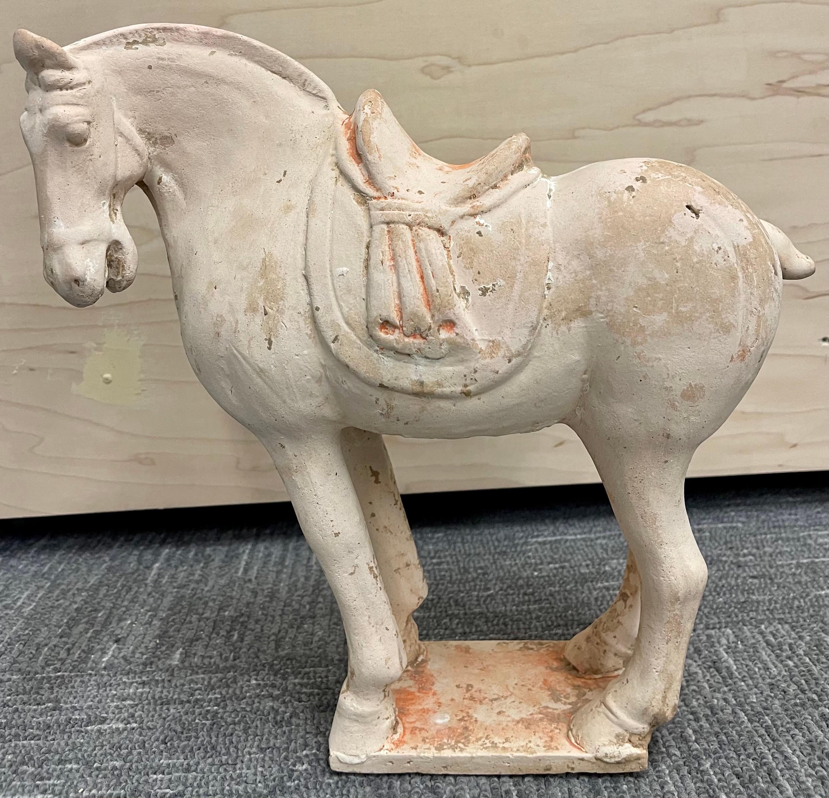 Tang style pottery horse. Roof tile manner, right facing with matching scalloped saddle drapes (one broken and missing tail), nice polychrome.