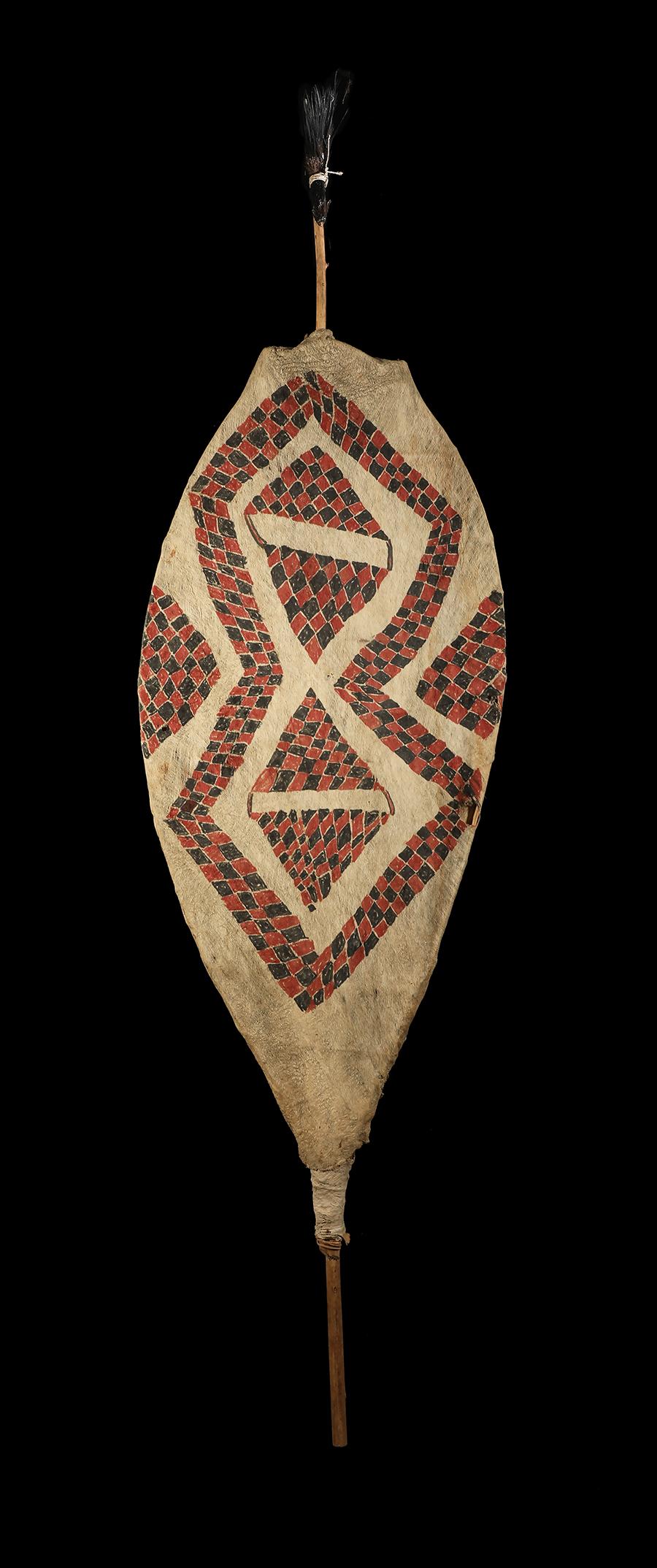 Tapa dance shield.
Baining People, New Britain, Papua New Guinea.
First half, 20th century
Pounded mulberry bark painted with natural pigments
Measures: 7 1/2 feet high (approx) x 26 ins wide (225 x 65 cm).

Provenance: Loed von Bussel,