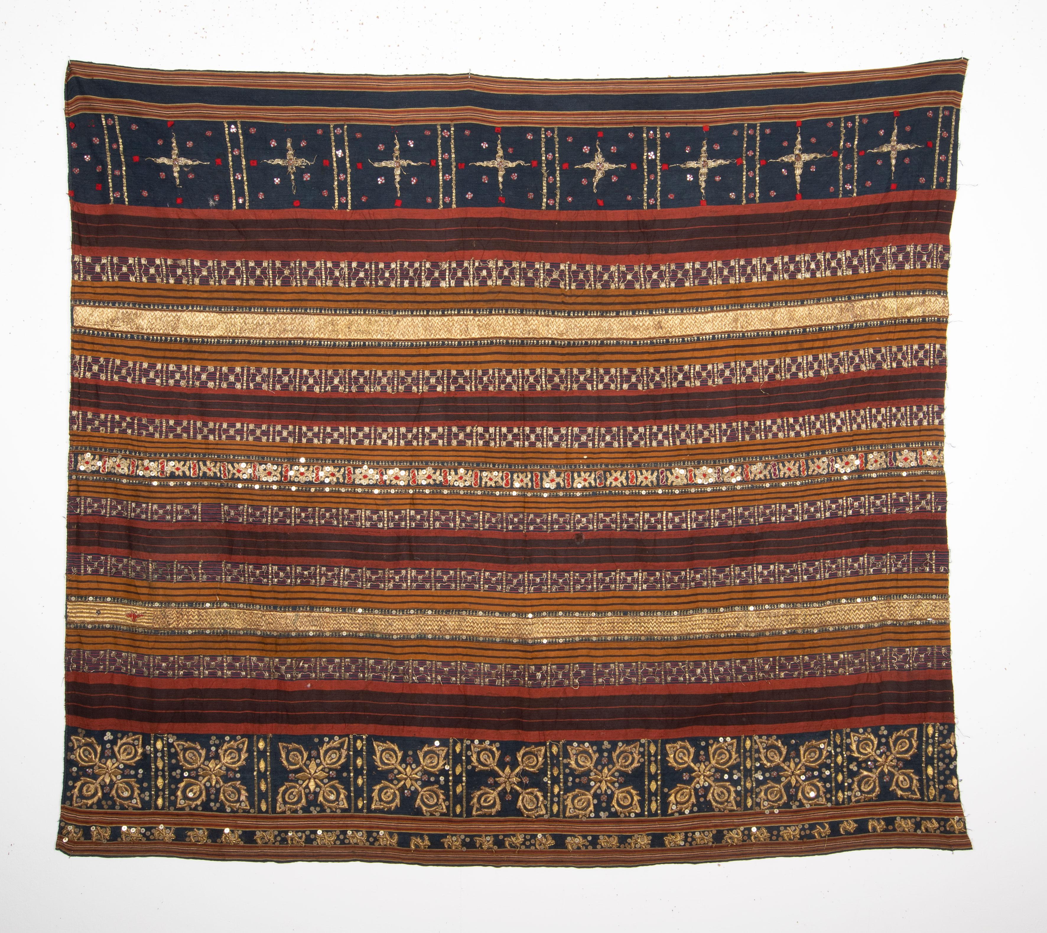 The piece is in rather good condition, embroidered with traditional design elements and materials.
