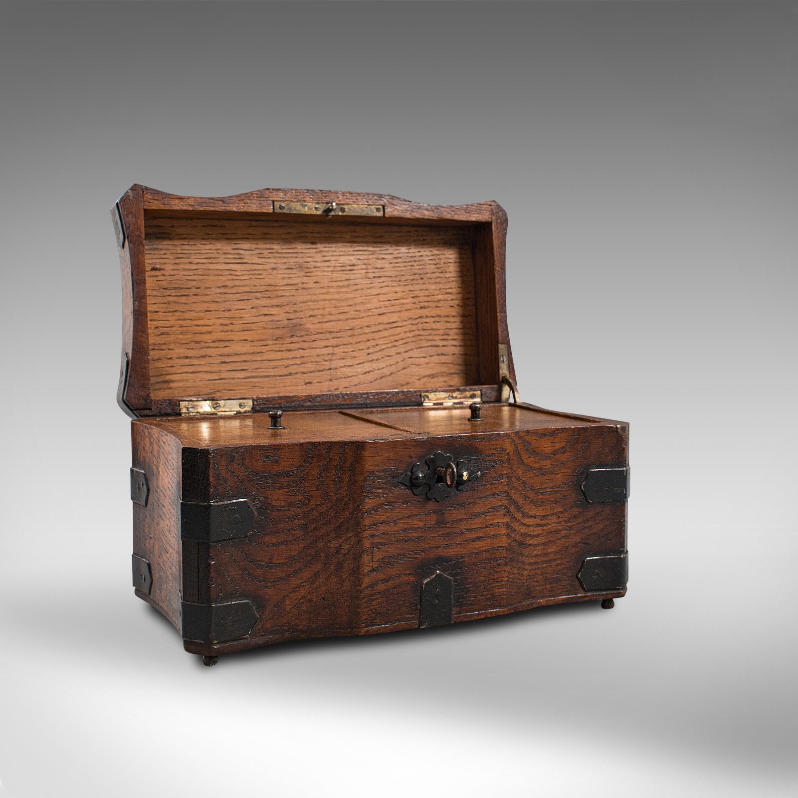 This is a superb antique tea box. An English, oak and iron-bound connoisseur caddy or case, dating to the Georgian period, circa 1800.

Store you treasured blends within this delightful caddy
Displaying a desirable aged patina
Select oak offers