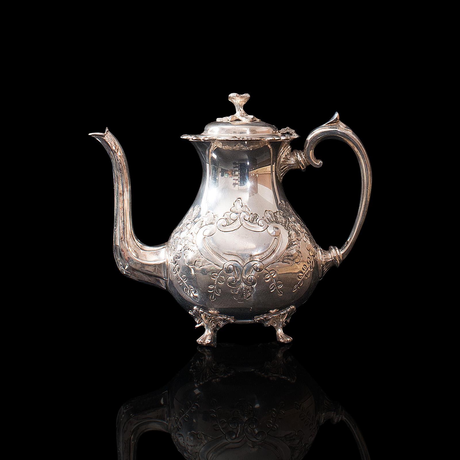 This is an antique tea service. An English, silver plated, hand chased teapot and jug set by John Turton of Sheffield, dating to the late 19th century, circa 1900.

Pleasingly decorative, late Victorian afternoon tea service
Displaying a