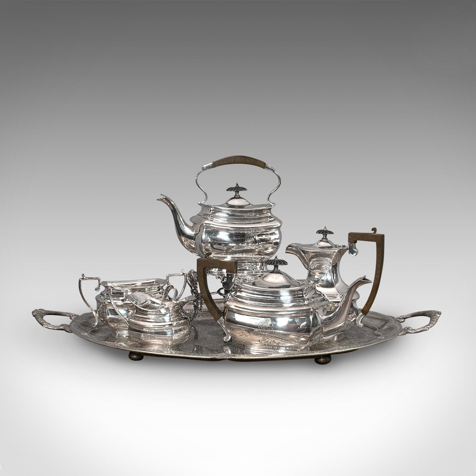 This is an antique tea service. An English, silver plate 6 piece serving set by J.B. Chatterley & Sons of Birmingham, dating to the Edwardian period, circa 1910.

Attractive service with engraved detail
Displays a desirable aged