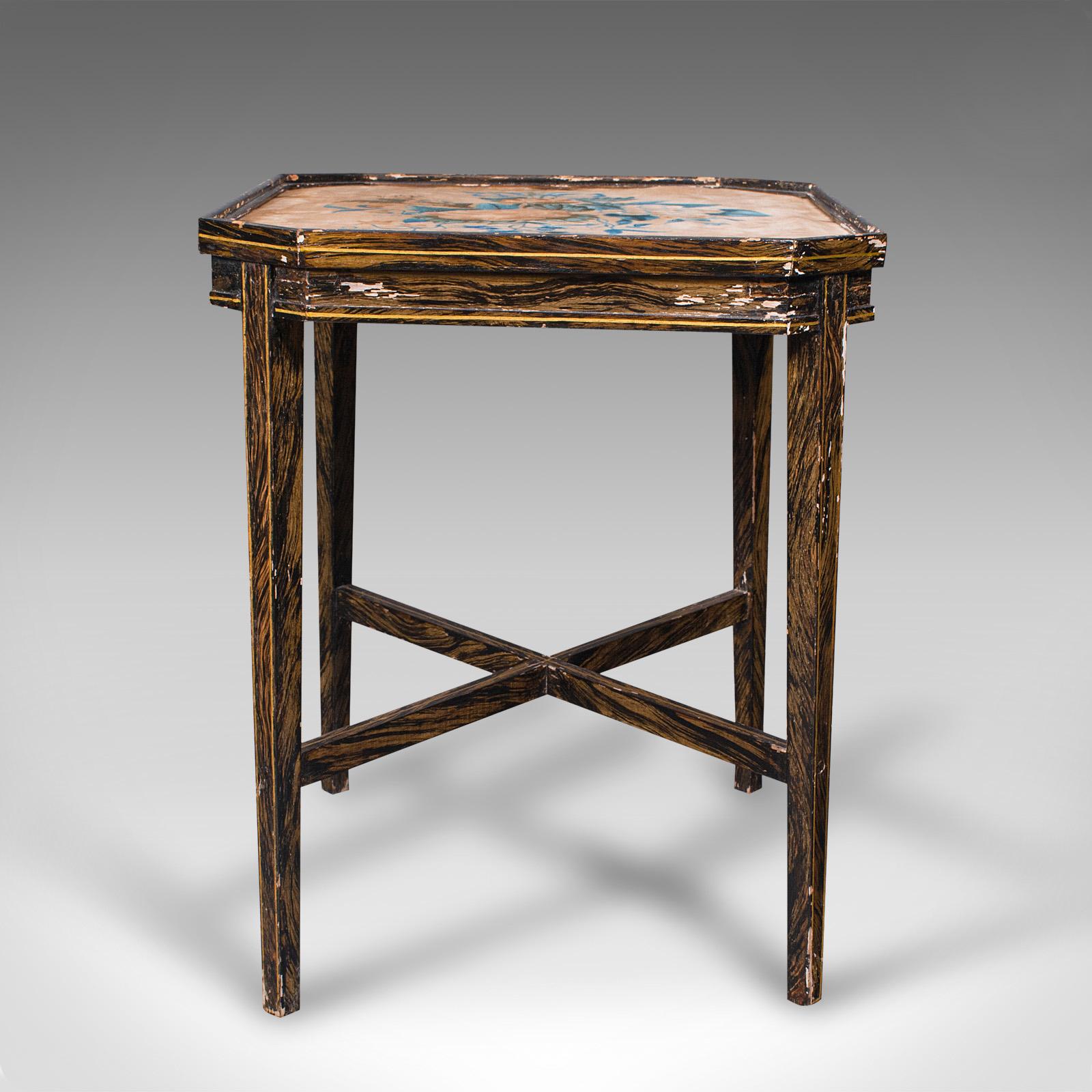This is an antique tea table. An English, hand-painted beech occasional or side table with velvet top, dating to the Edwardian period, circa 1910.

Distinctively hand-painted with fascinating form
Displays a desirable aged patina with light wear