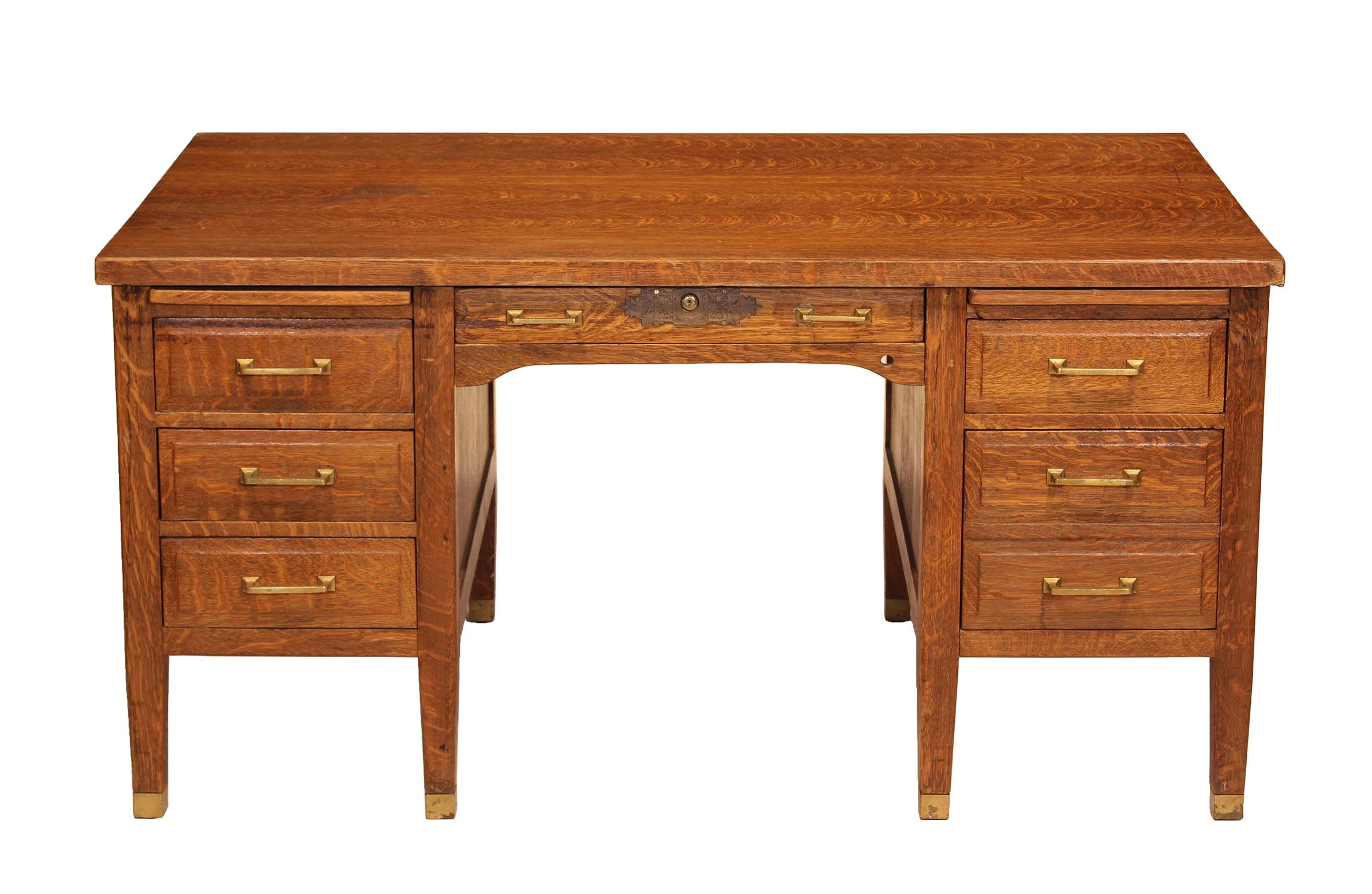 Authentic 1940s tiger oak teachers' desk. Solid work desk featuring brass handles, feet caps and decorative lock. Key included and mechanism is fully functional - will lock all drawers. Desk measures 60