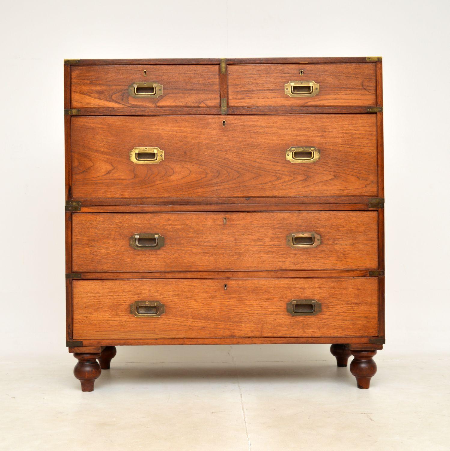 A fantastic antique military campaign chest in teak and brass. This was made in England, it dates from around the 1840-1860 period.

It is of amazing quality and is a very useful size, with lots of storage space. This sits on nicely turned legs