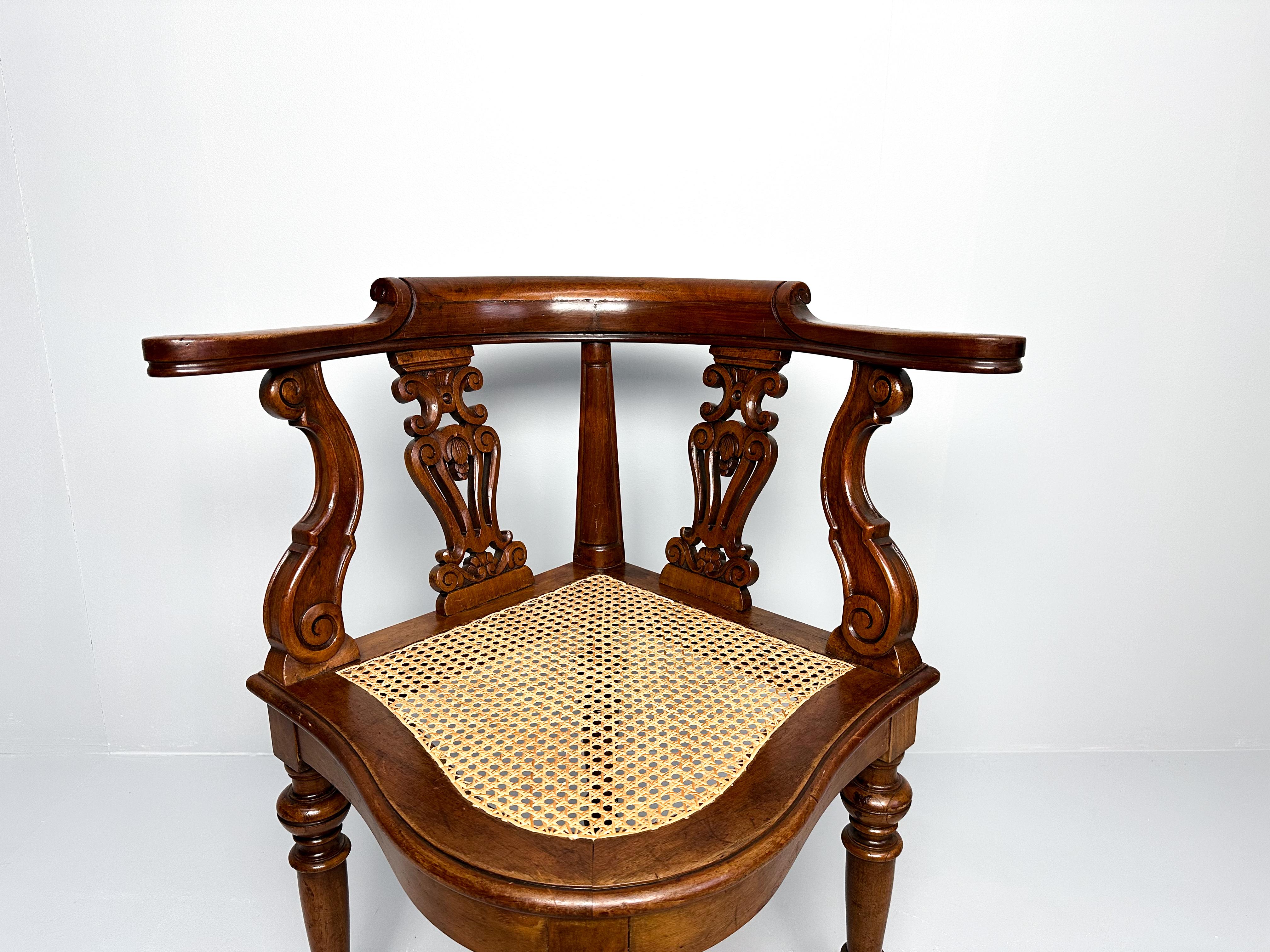 Cane Antique Teak Corner Chair with Carved Backrest and Webbing Seat, 19th Century For Sale