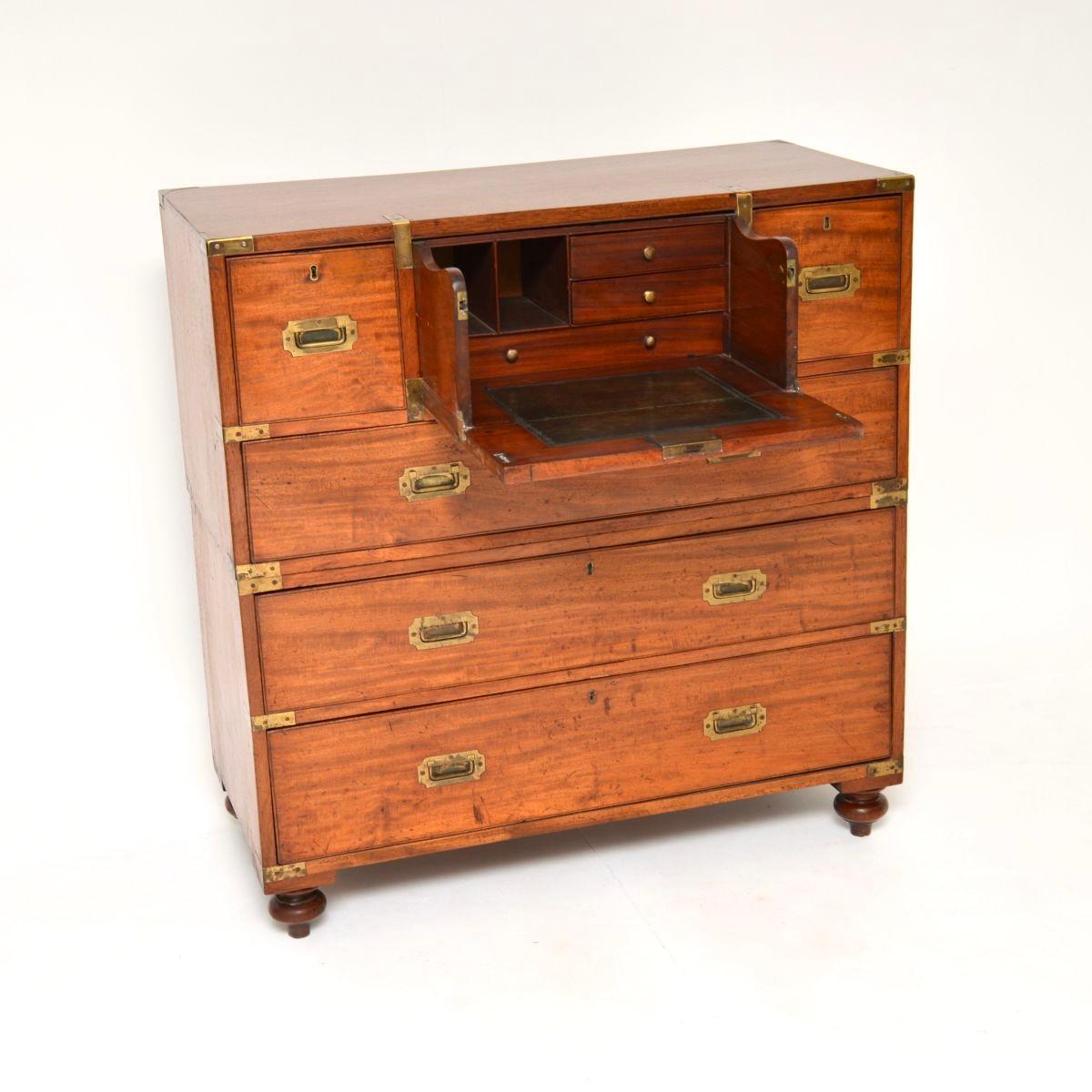 An outstanding antique teak military campaign secretaire chest of drawers, dating from around the 1860-1880 period.

The quality is absolutely amazing, this is a very smart and very useful item. The top central drawer slides out and pulls down to