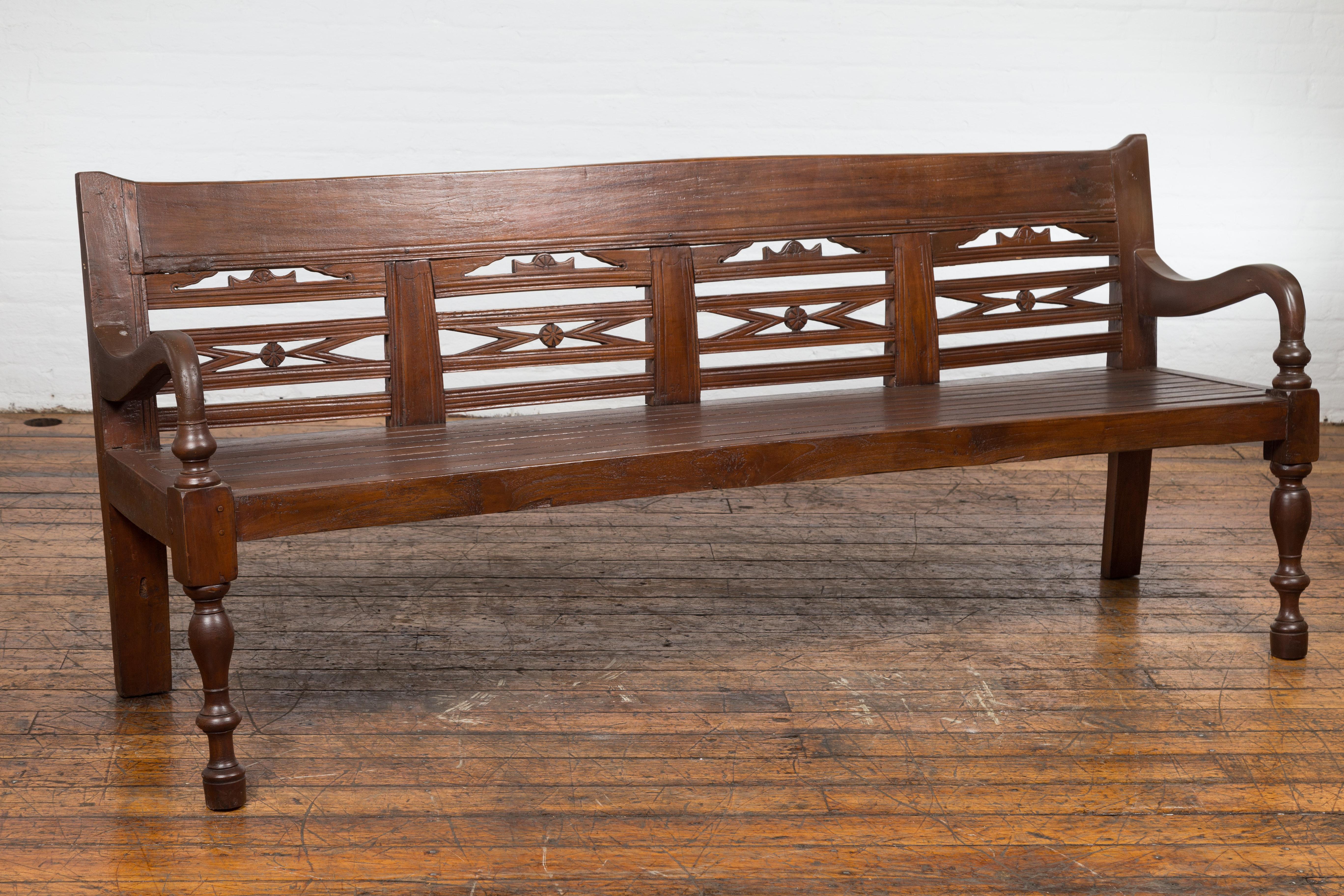 Antique Teak Wood Javanese Settee with Hand-Carved Back and Scrolling Arms For Sale 6