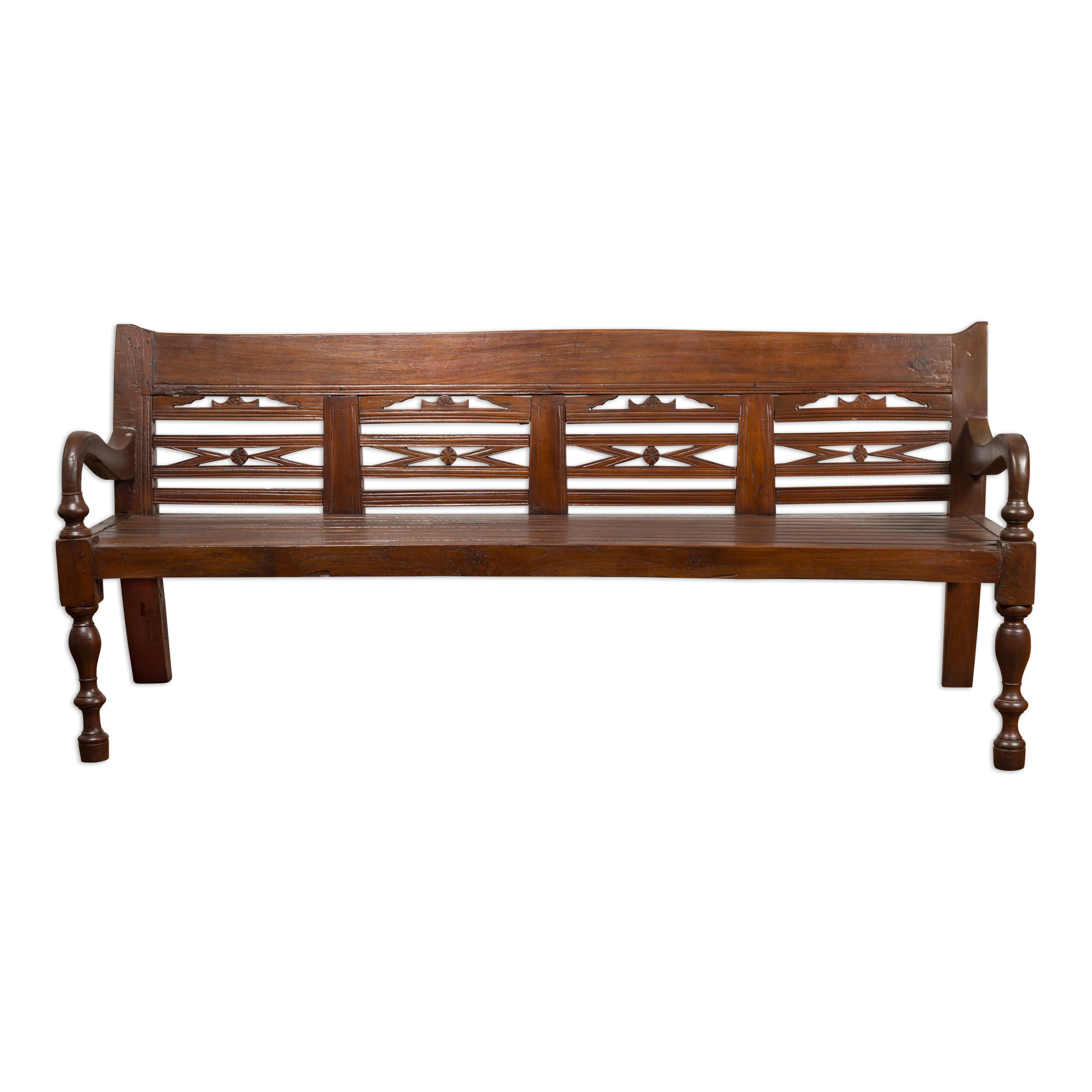 Antique Teak Wood Javanese Settee with Hand-Carved Back and Scrolling Arms For Sale 11