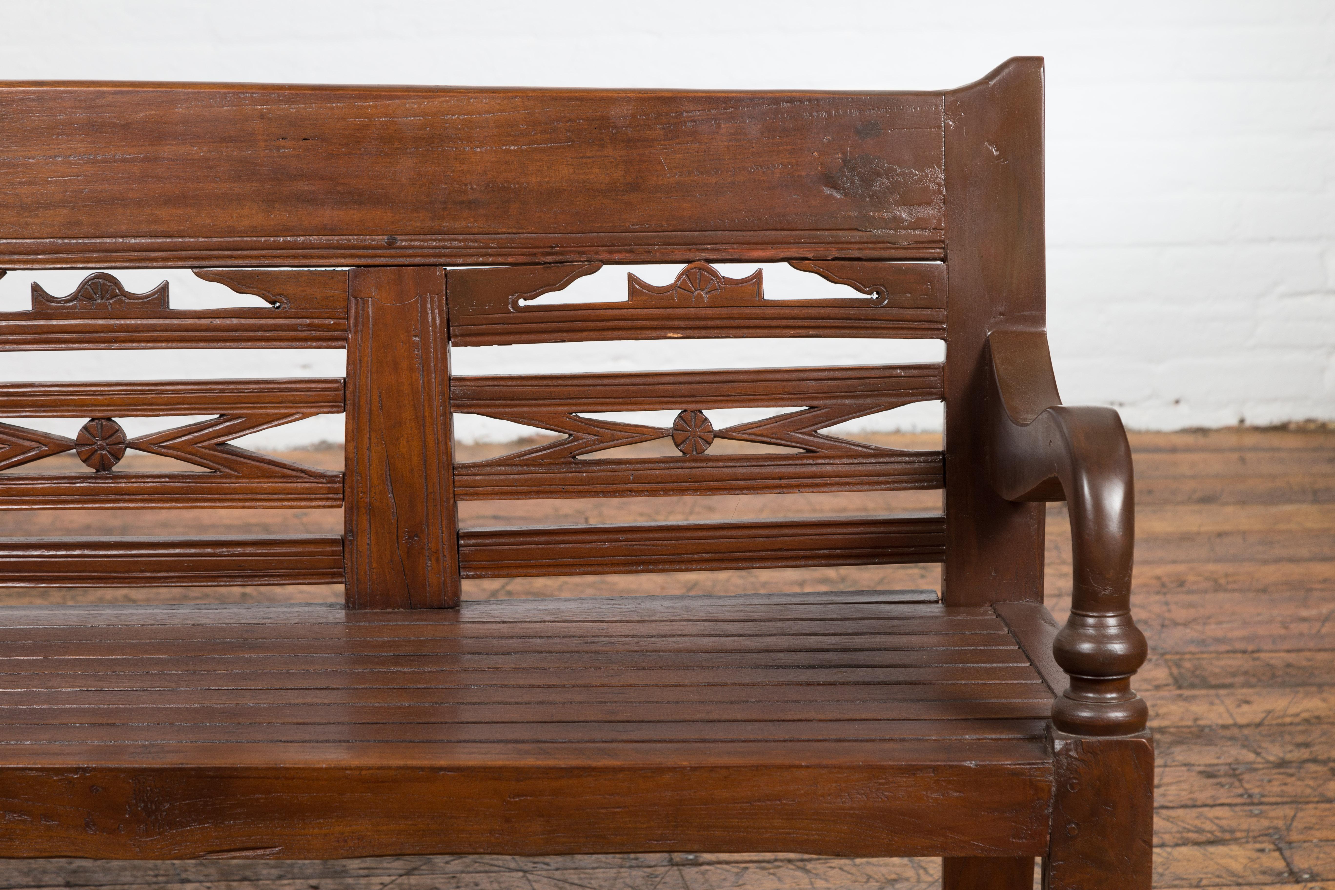 Antique Teak Wood Javanese Settee with Hand-Carved Back and Scrolling Arms In Good Condition For Sale In Yonkers, NY