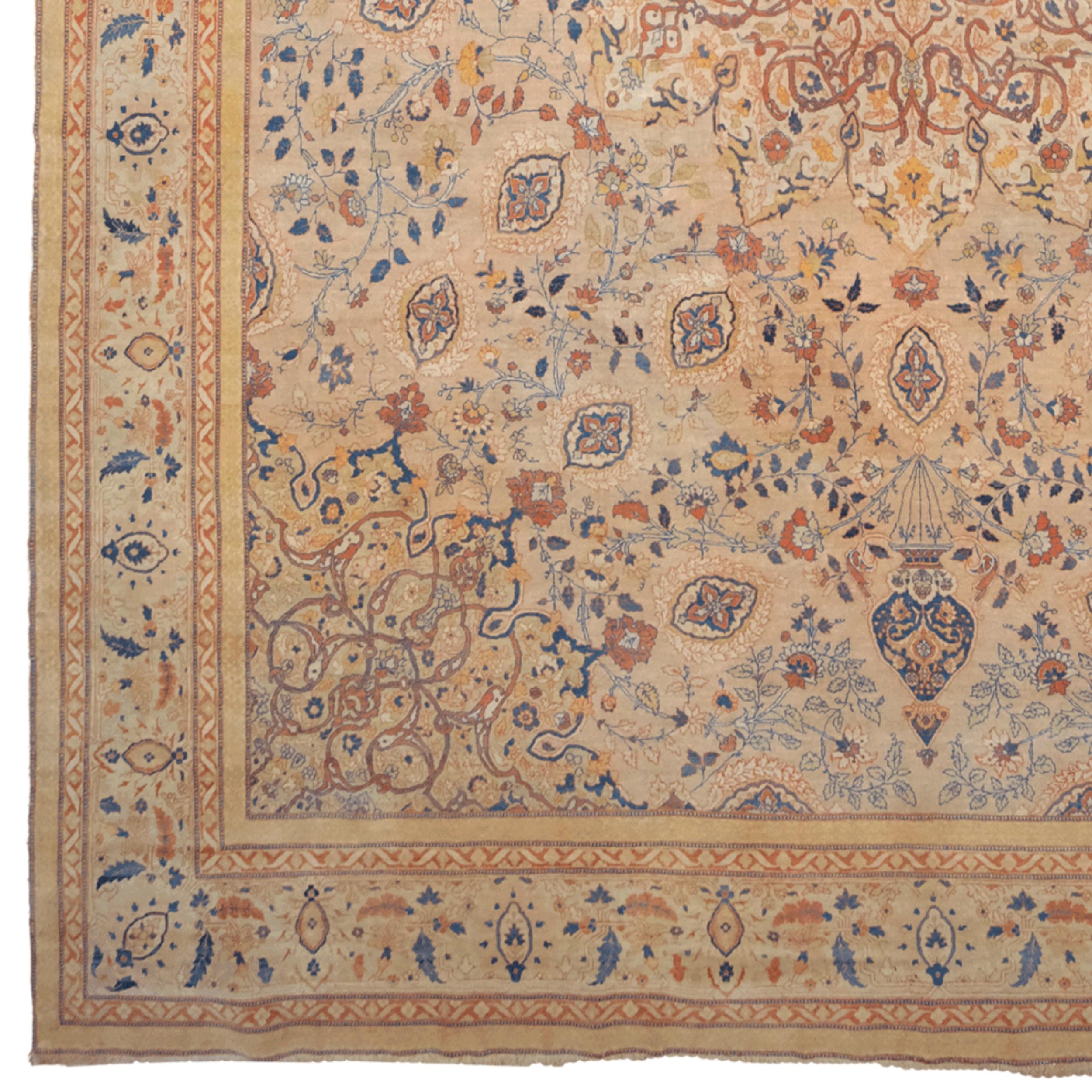 This impressive antique Tabriz carpet is a unique piece that was woven by master hands in the late 19th century, offering a perfect combination of art and elegance. Reflecting the weaving tradition of Tabriz, one of Iran's famous carpet centers,