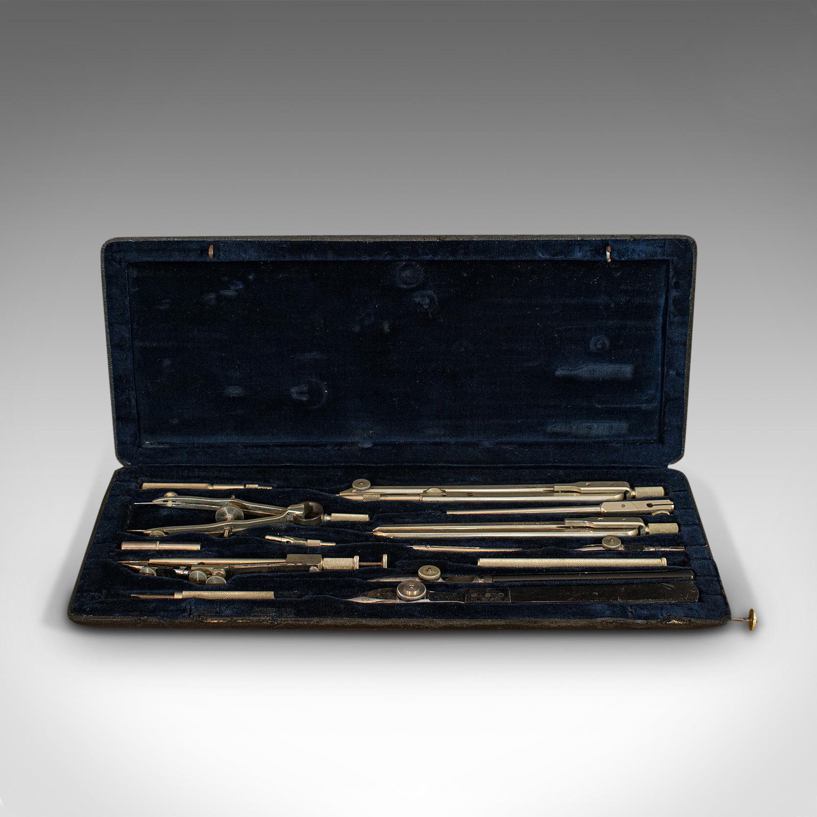 This is an antique technical drawing set. A German, architect's or cartographer's instrument case by Wichmann, dating to the early 20th century, circa 1920.

Quality, 14-piece instrument set
Displays a desirable aged patina
Silver nickel tools
