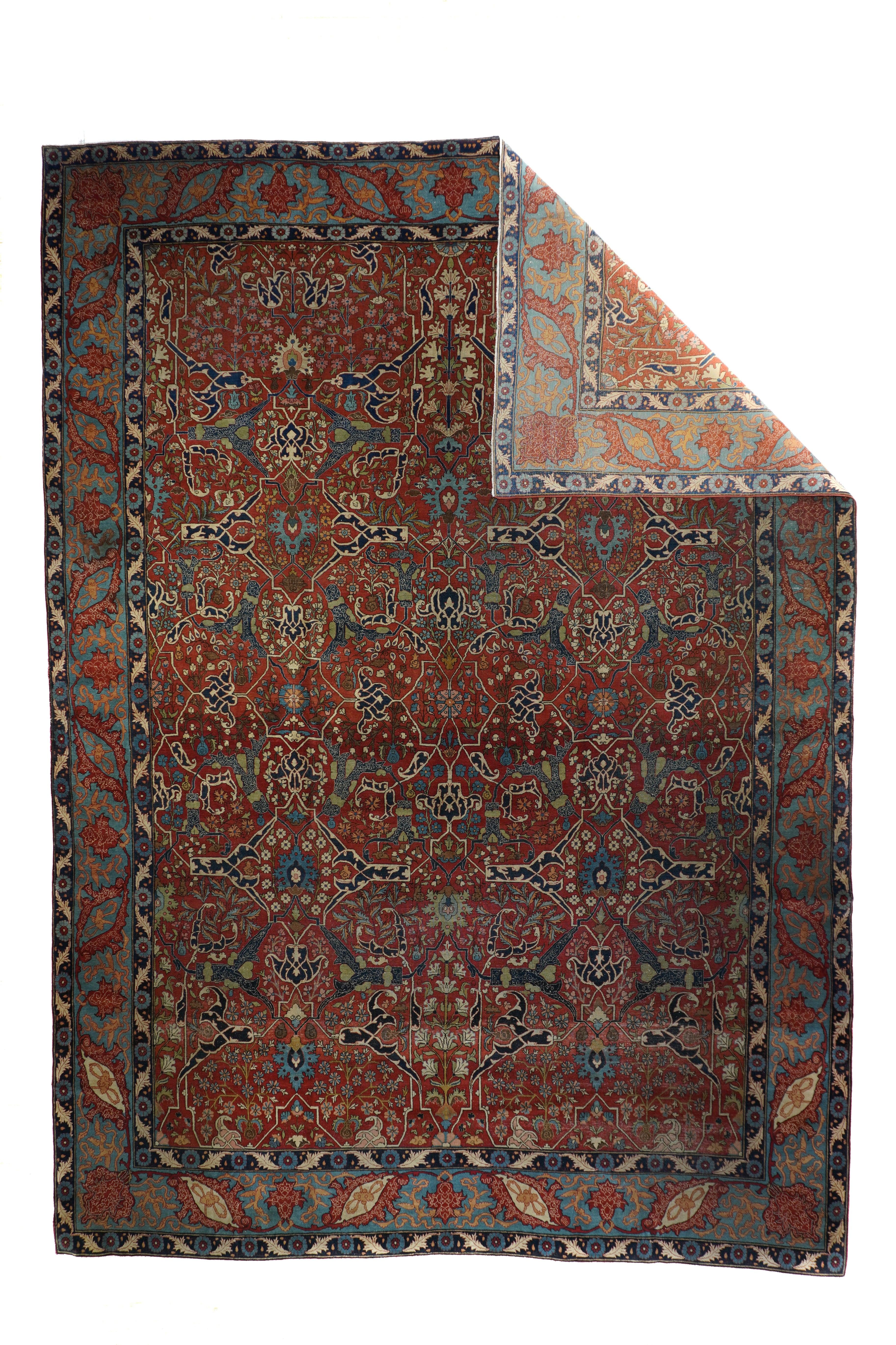 This finely woven interwar capital city carpet features a ruby field displaying a variant on the 