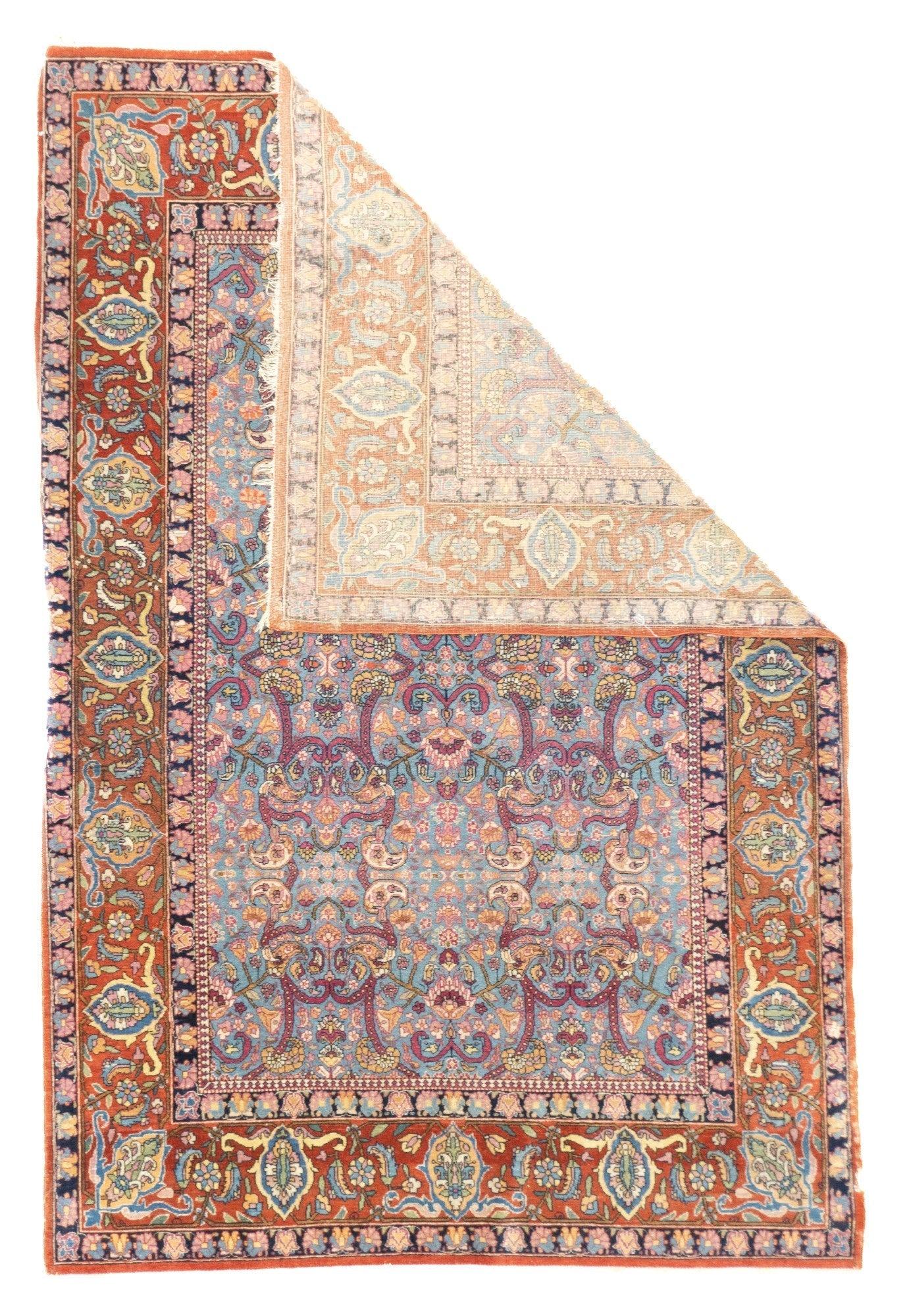 Antique Tehran Rug 4'4'' x 6'9''. This finely woven, impeccably drawn central Persian city scatter shows a rare pale blue field overlaid by strap work decorated by floriated botehs. Millefleurs filler fits neatly in the strap work. Red border with