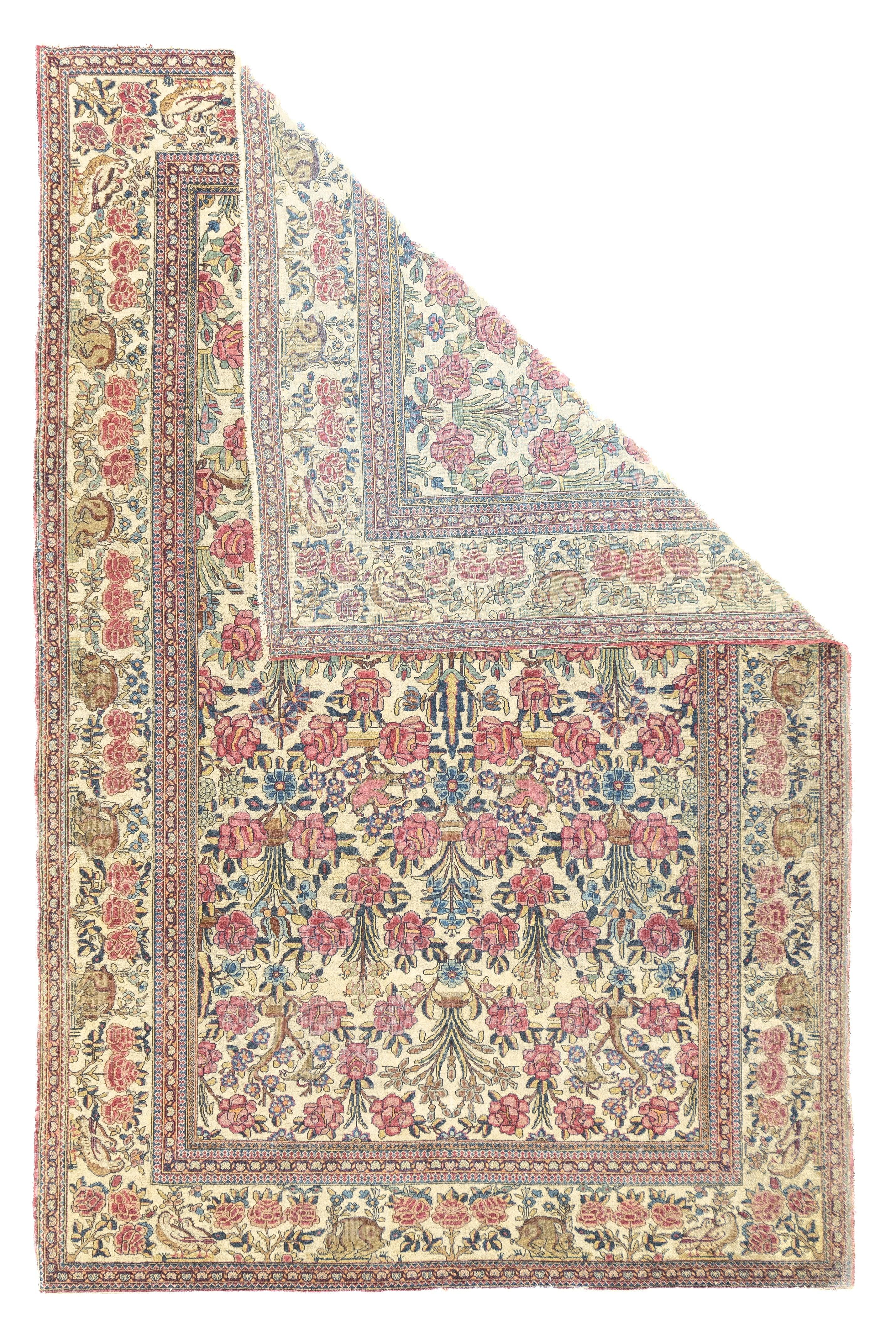 Antique Tehran Rug 4'7'' x 6'11''. The cream field displays a directional pattern of roses, with an implicit central cypress tree axis. Similar ecru main border with roses and hunching hares.. Obviously unique, especially desirable if you are a