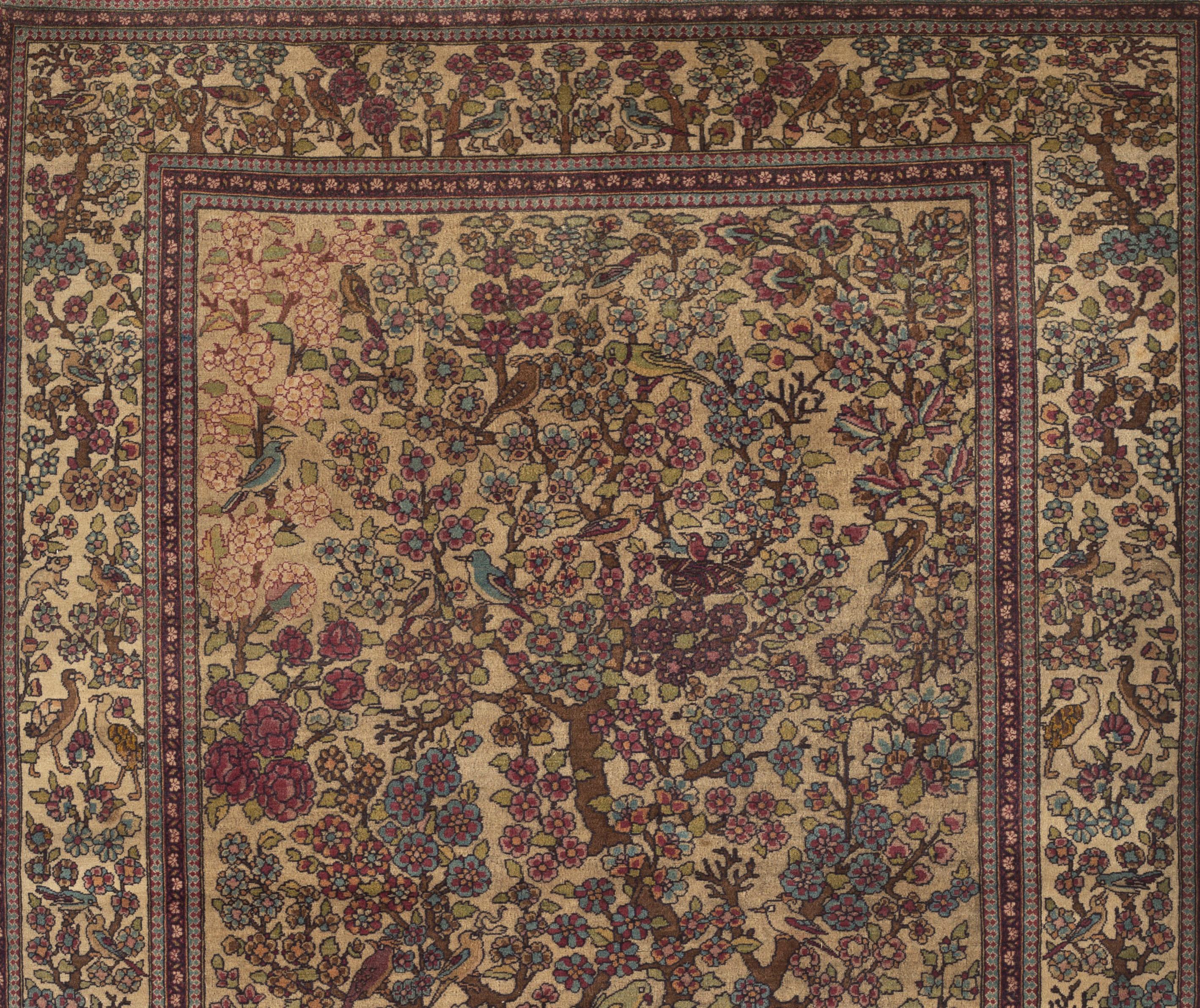 Antique Tehran rug circa 1880. Rug production in Tehran the capital of Persia was only for a short period from around 1860s to the 1950s and are considered to be of a high quality. This lovely example with a flowering tree in the center surrounded