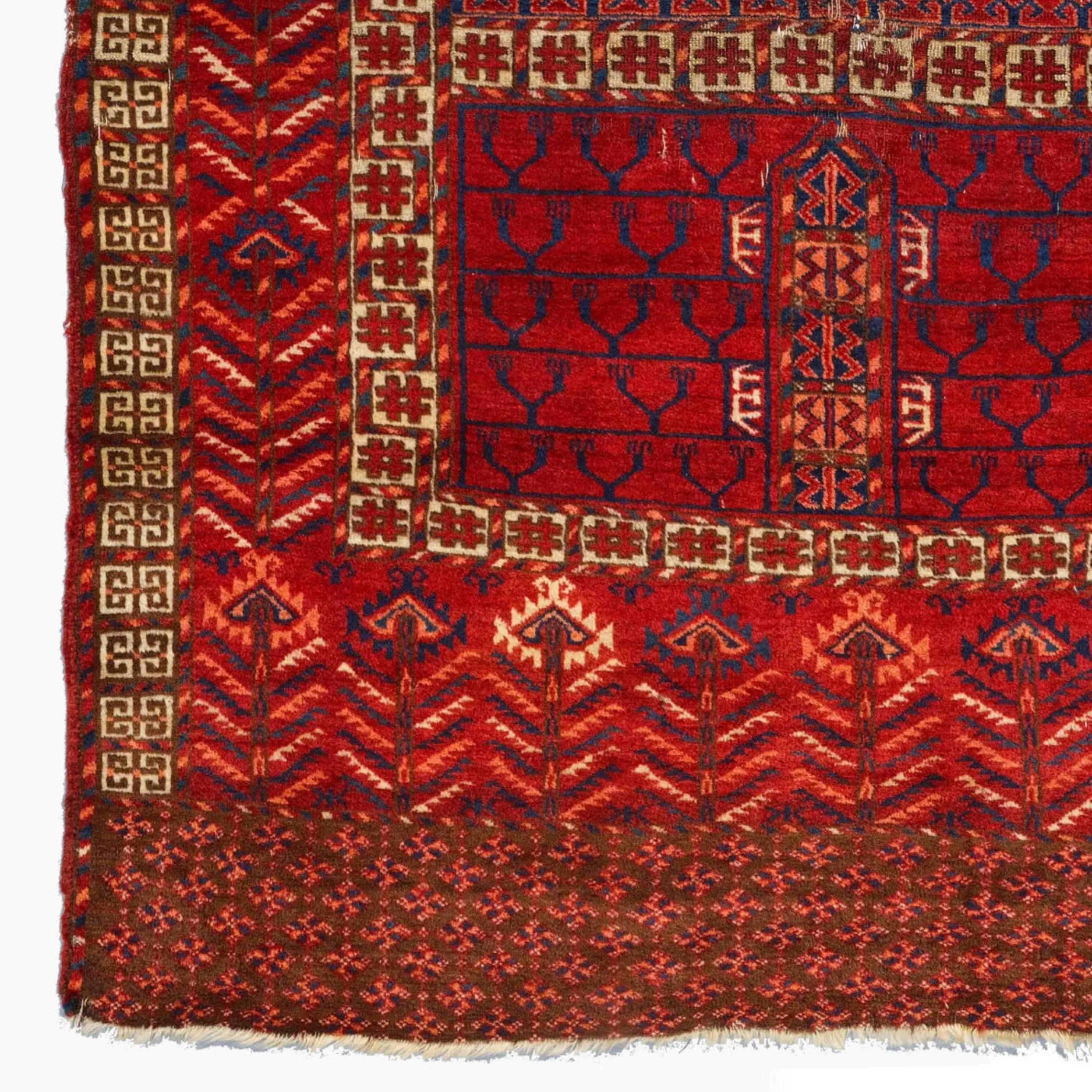 Antique Tekke Ensi - Middle of 19th Century Turkmen Tekke Ensi
Size 118 x 165 cm (3,87 - 5,41 ft)

This elegant mid-19th-century Turkmen Tekke Ensi carpet is a rare work of art. This hand-woven rug in rich red and gold tones showcases the finest