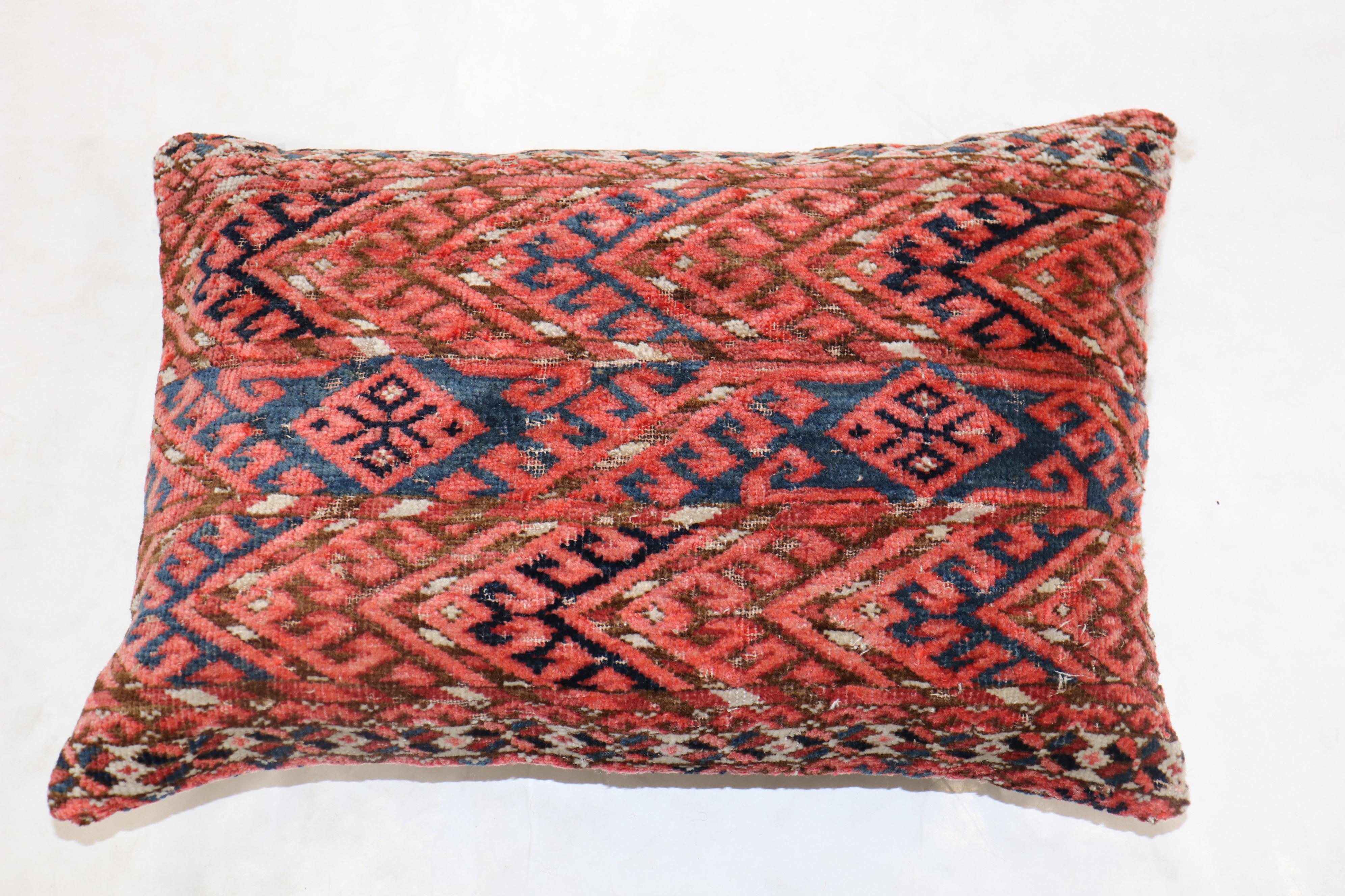 Pillow made from a 19th-century Tekke rug in a lumbar size.

Measures: 16