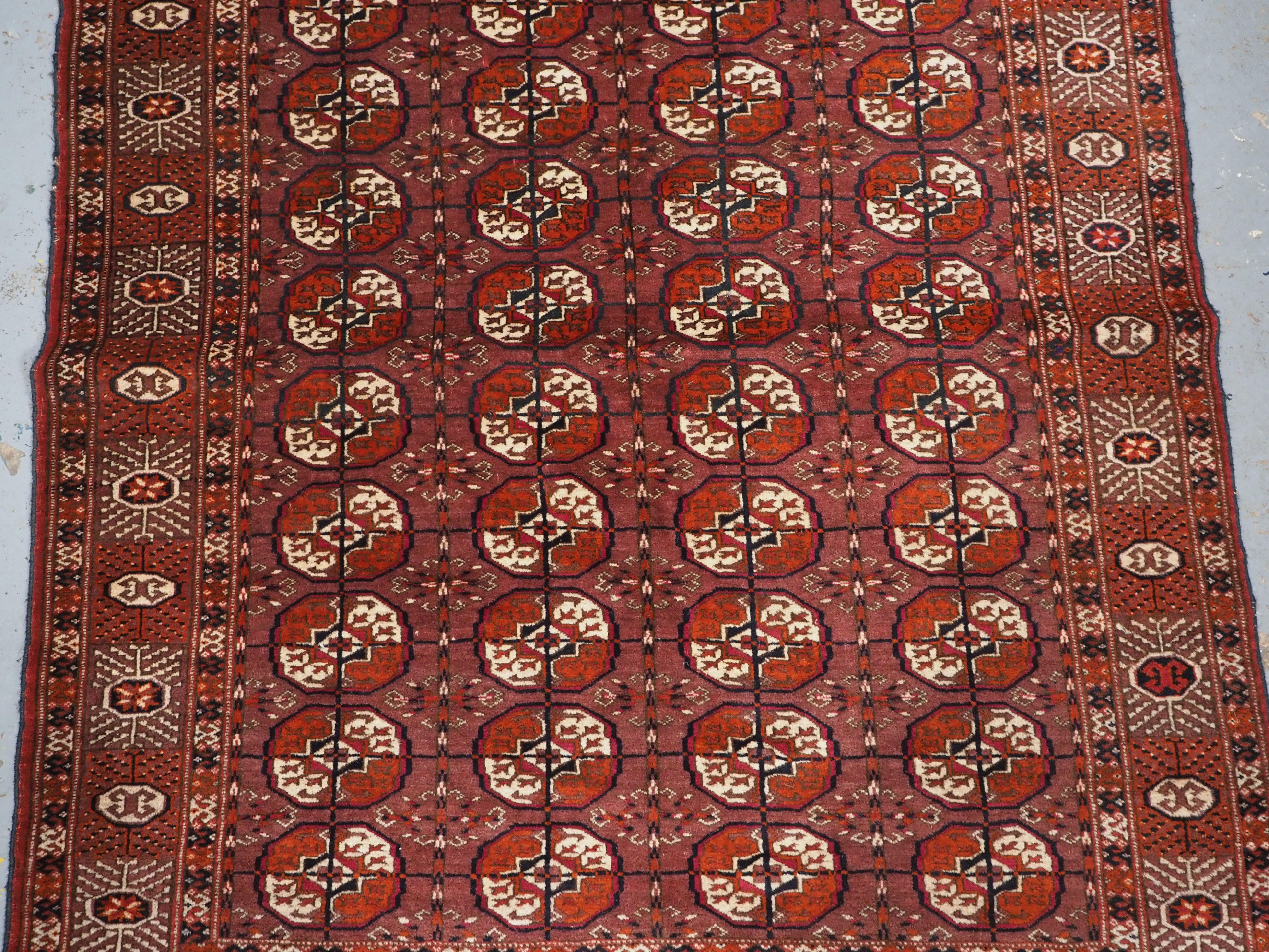 Antique Tekke Turkmen ‘dip khali’ rug with scarce aubergine ground colour, 1900. In Good Condition For Sale In Moreton-In-Marsh, GB
