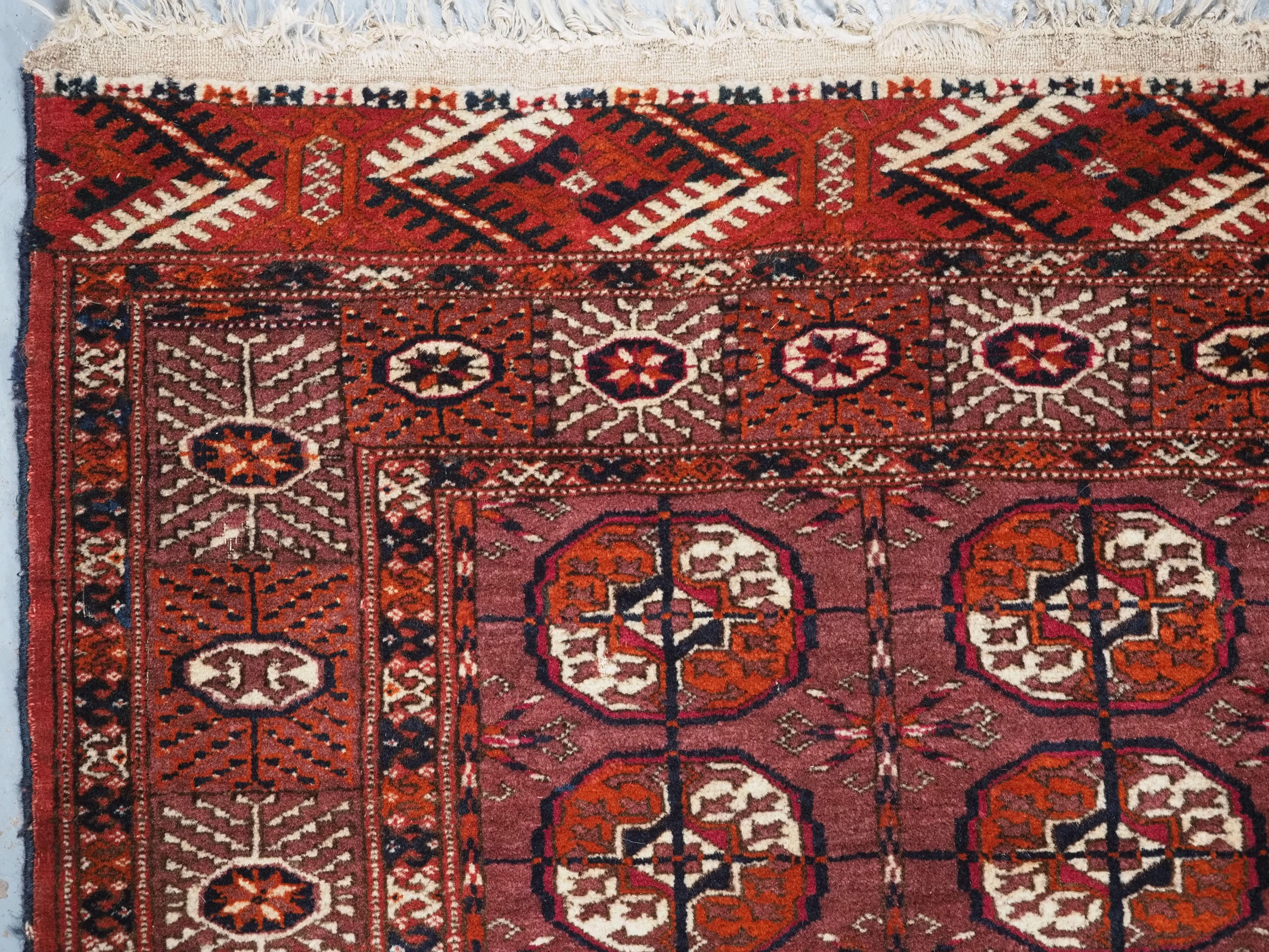Wool Antique Tekke Turkmen ‘dip khali’ rug with scarce aubergine ground colour, 1900. For Sale