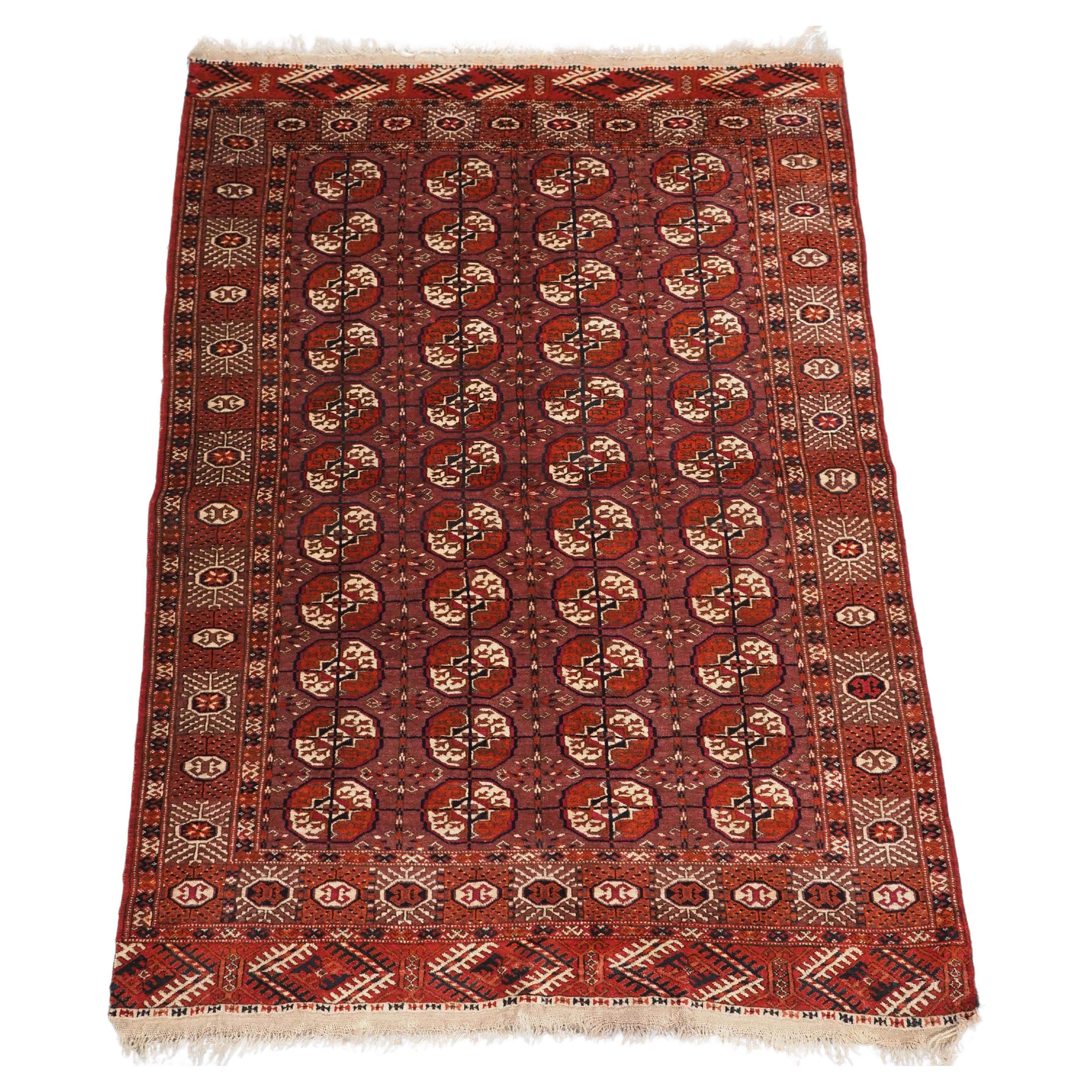Antique Tekke Turkmen ‘dip khali’ rug with scarce aubergine ground colour, 1900.