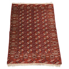 Used Tekke Turkmen ‘dip khali’ rug with scarce aubergine ground colour, 1900.
