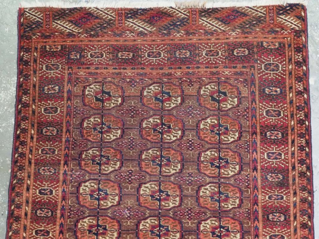 Antique Tekke Turkmen rug of traditional design, the rug is of a rich red/brown colour with cochineal highlights
Circa 1900

The rug has a traditional Tekke gul design with 3 rows of 7 guls These are often referred to as 'dowry' rugs The main border