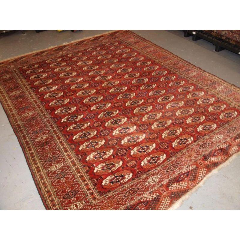 A good Tekke main carpet of small square size, the madder red field has well drawn Tekke guls in 5 rows of 15. The border is of the sunburst design.

The carpet is in good condition with even wear with medium pile. There are one or two spots of