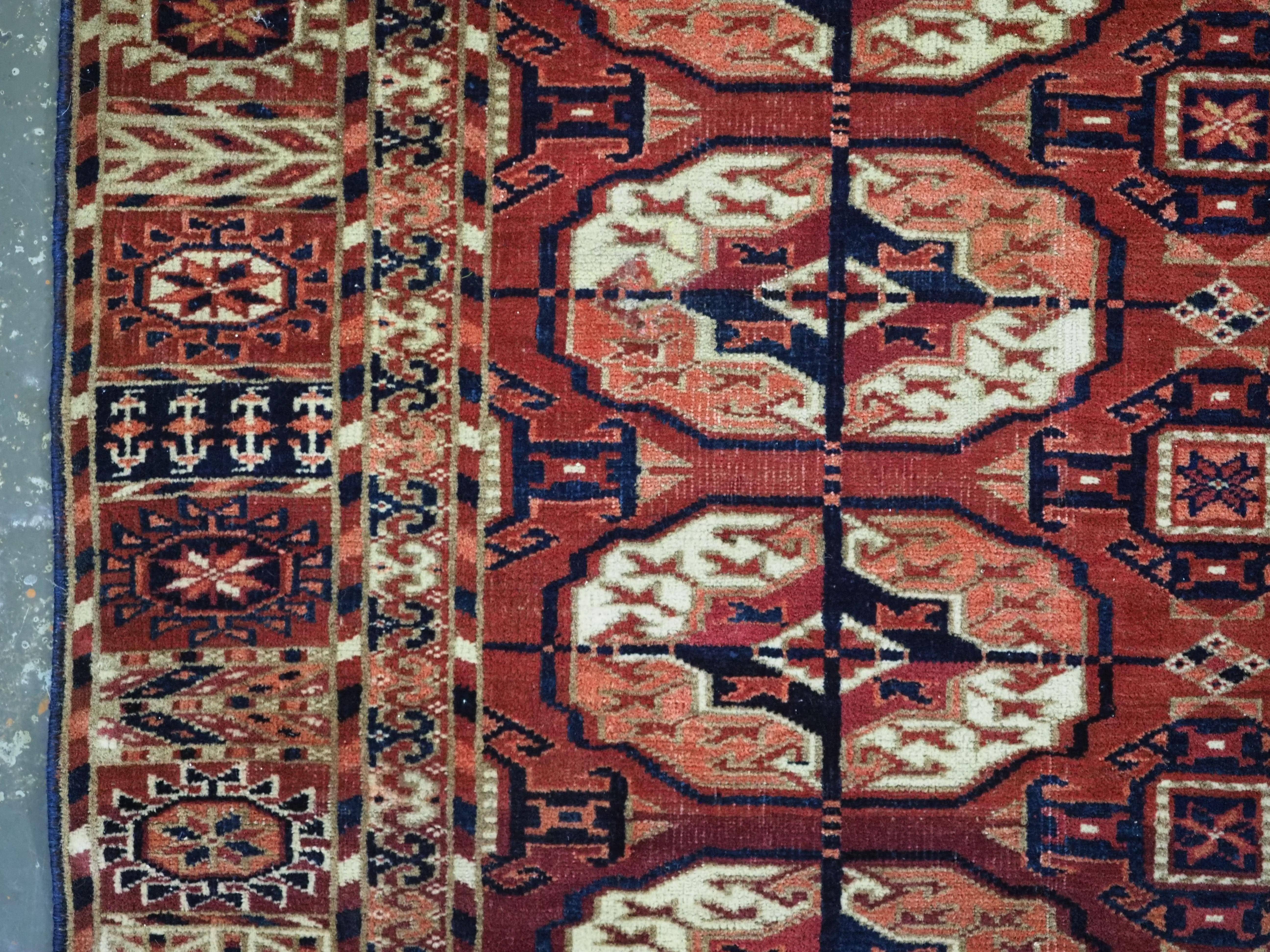 Asian Antique Tekke Turkmen rug of fine weave and small square size, circa 1880. For Sale
