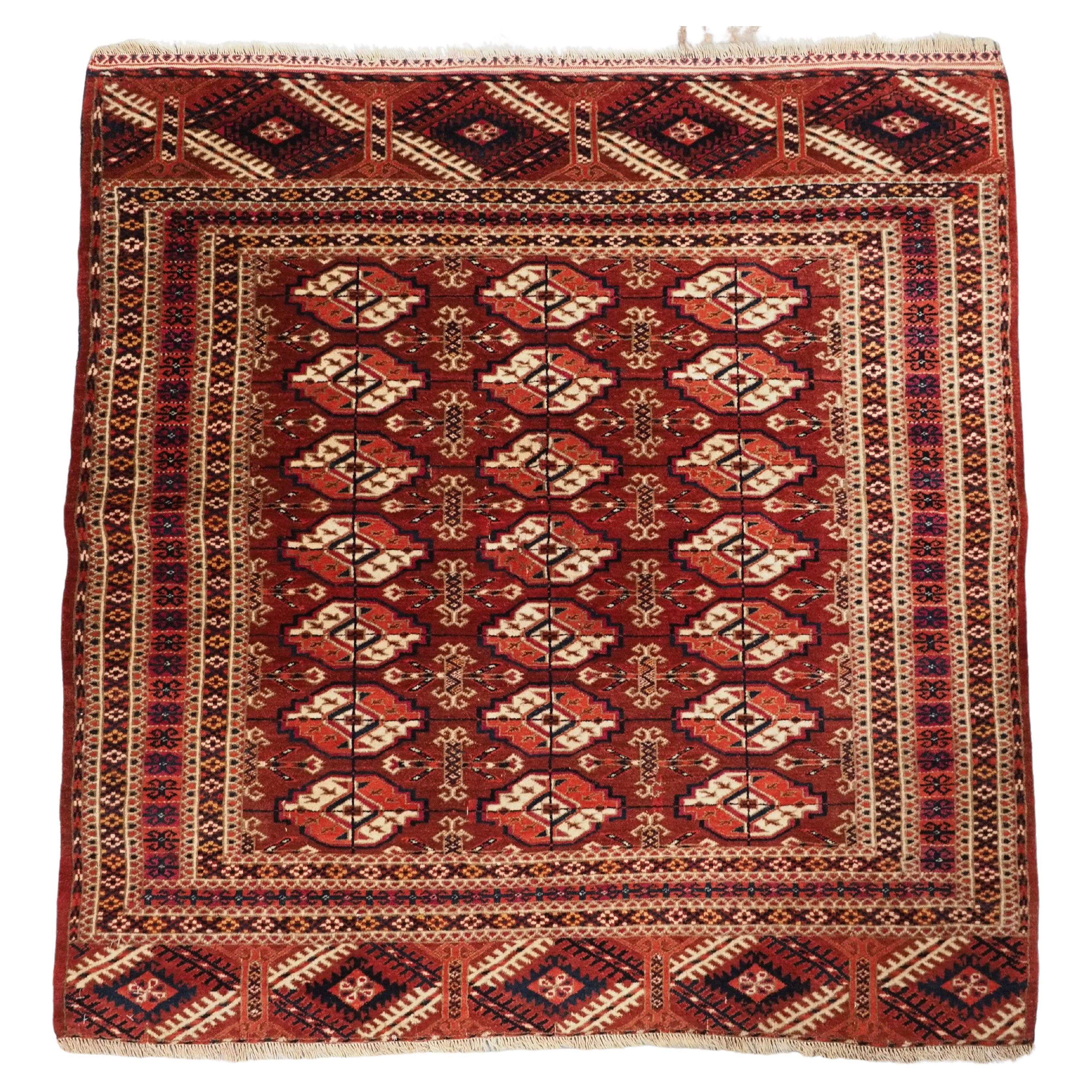 Antique Tekke Turkmen rug of fine weave and small square size.  Circa 1890.