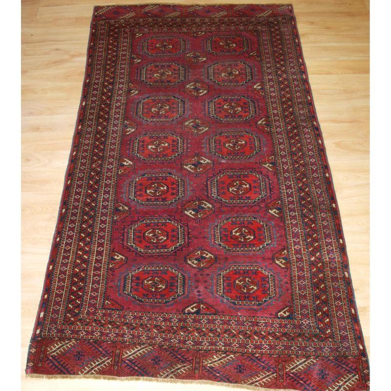 Antique Tekke Turkmen rug of small size, with fine weave, superb Cochineal colour.

This is a good example of a Tekke rug with Salor turreted guls, this rug has 2 rows of 7 guls with a very well drawn Salor minor gul. The colour palette is very