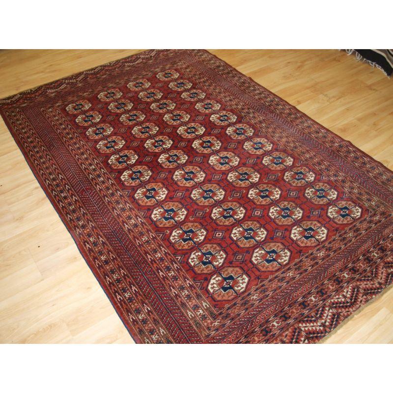 Antique Tekke Turkmen rug of traditional design and excellent colour, the rug is of a soft red colour.

The rug has a traditional Tekke gul design with 4 rows of 11 guls.

The rug is of a fine weave with excellent soft wool.

The rug is in
