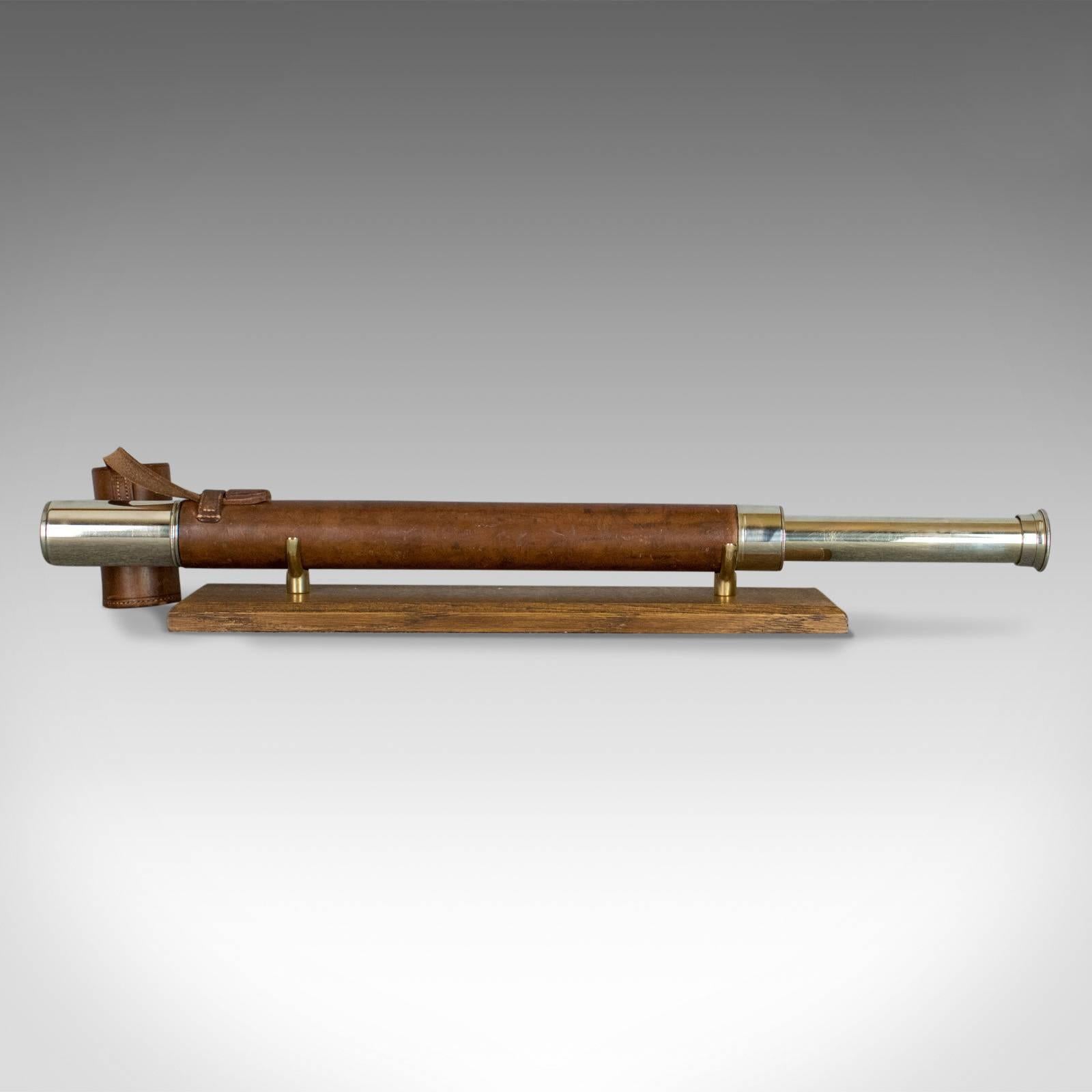 This is an antique telescope, a single draw refractor for terrestrial or astronomical use. An English, 'Officer of the Watch' telescope dating to the early 20th century.

Perfect for bird watching, landscape appreciation, wildlife, or maritime