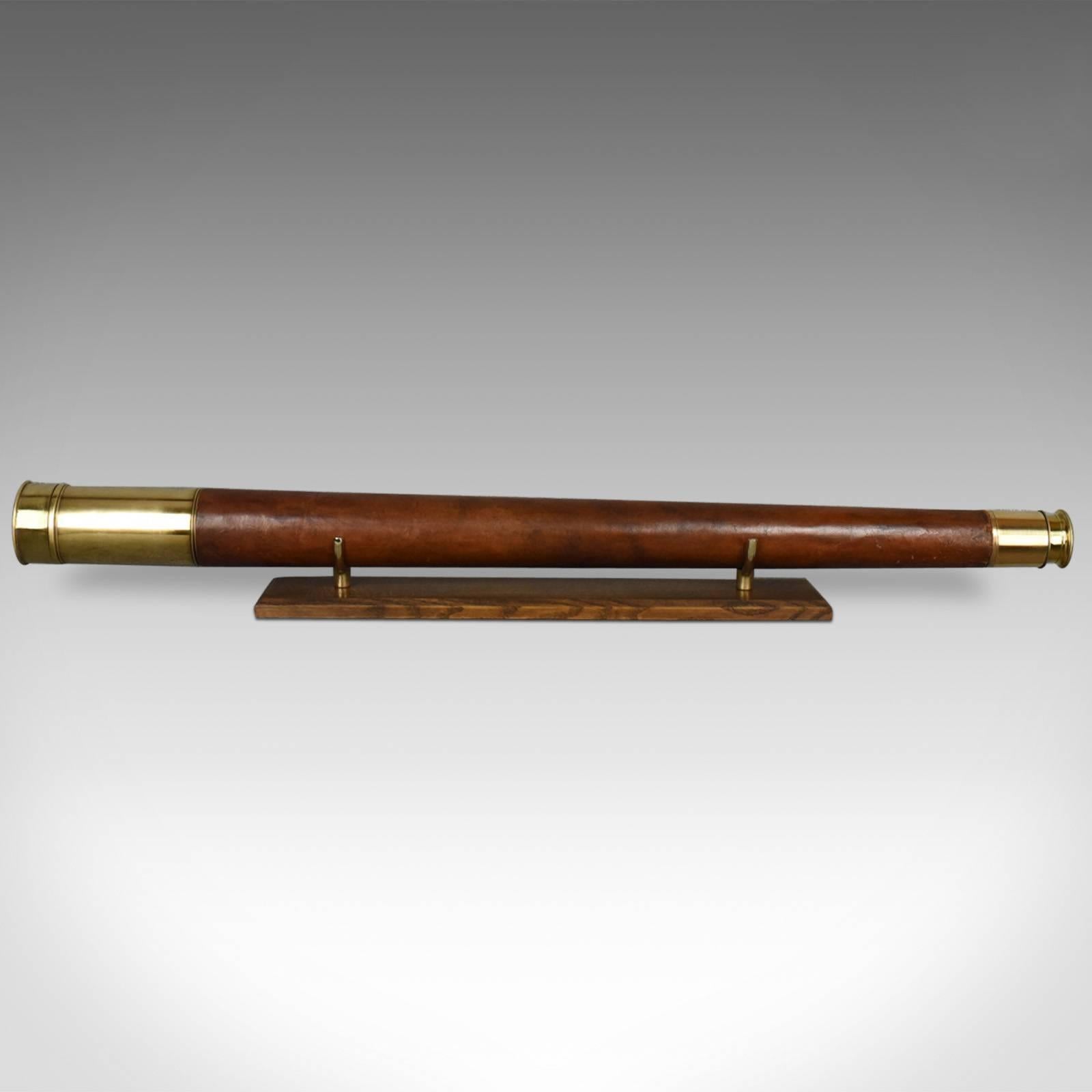 This is an antique telescope dating to the late 19th century, 1899.

In fine order physically and optically
Upright image, ideal for terrestrial or astronomical use
Delivered with a solid oak and brass, bespoke 'Captain's Stand'

Single draw