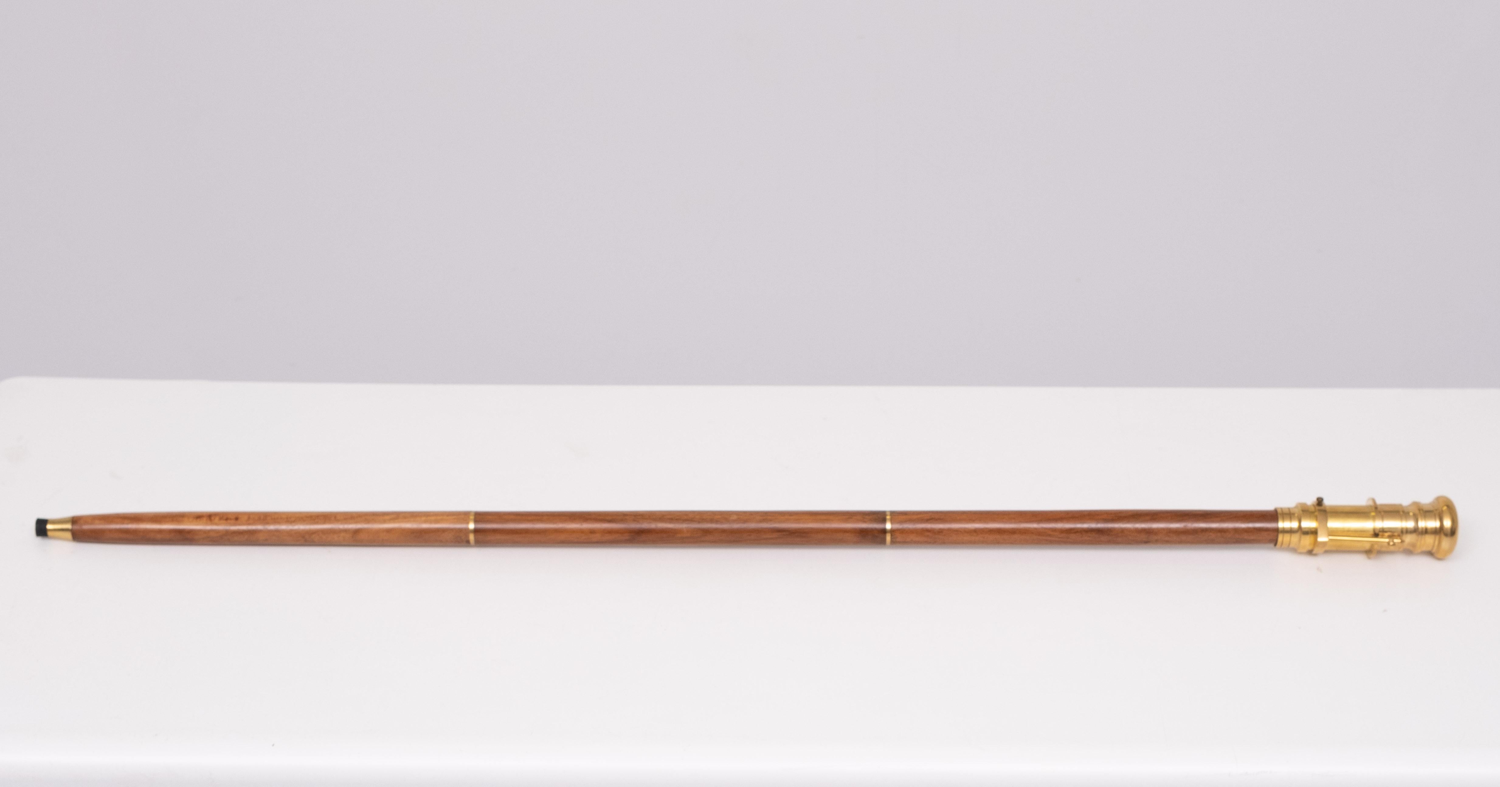 Love this novelty walking cane ,folding out Telescope . solid Brass .
3 parts Teak cane . works perfect. enlarged 3 times .  