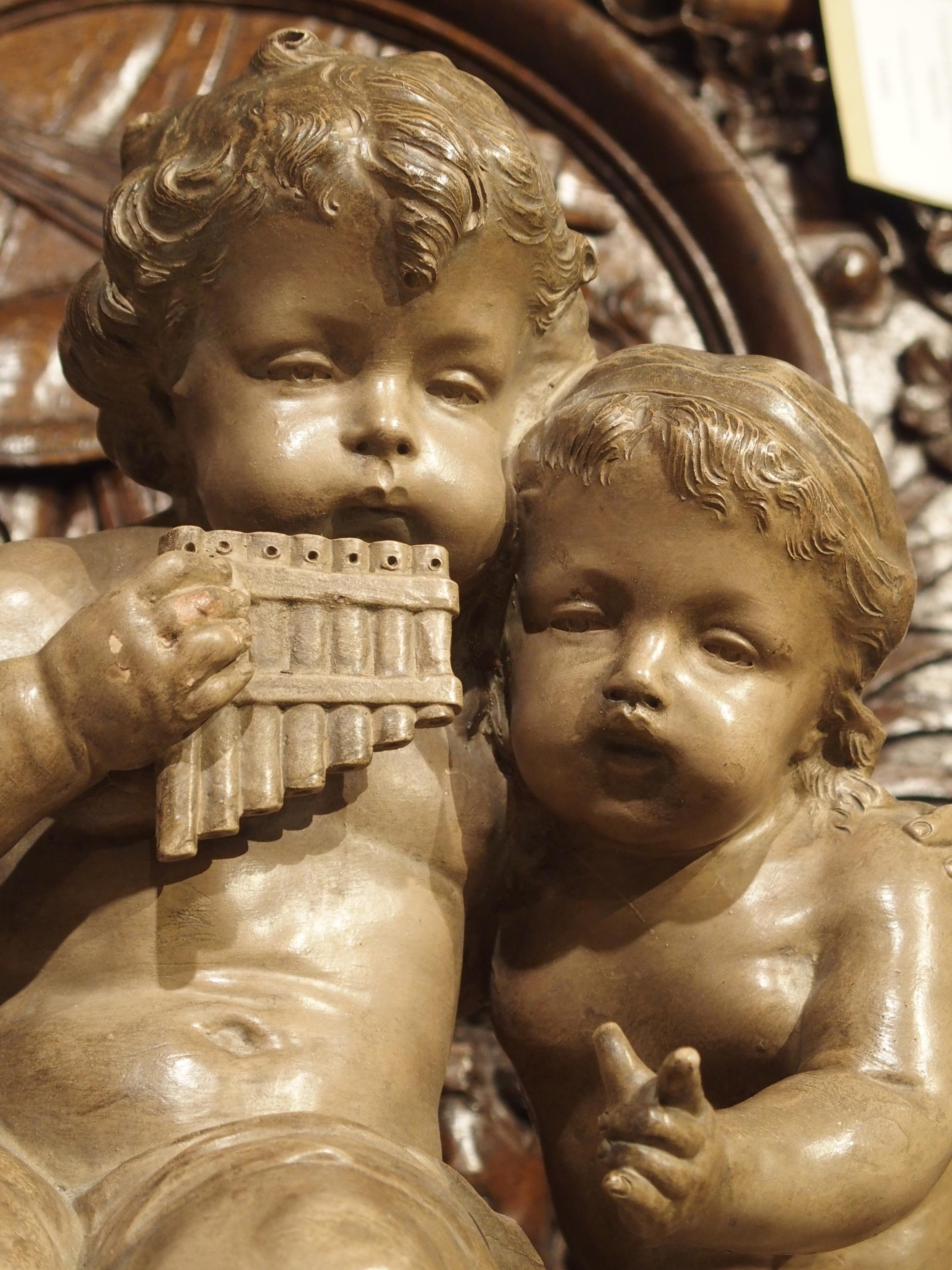 Carved Antique Terracotta of a Boy and Girl, France, Early 1900s