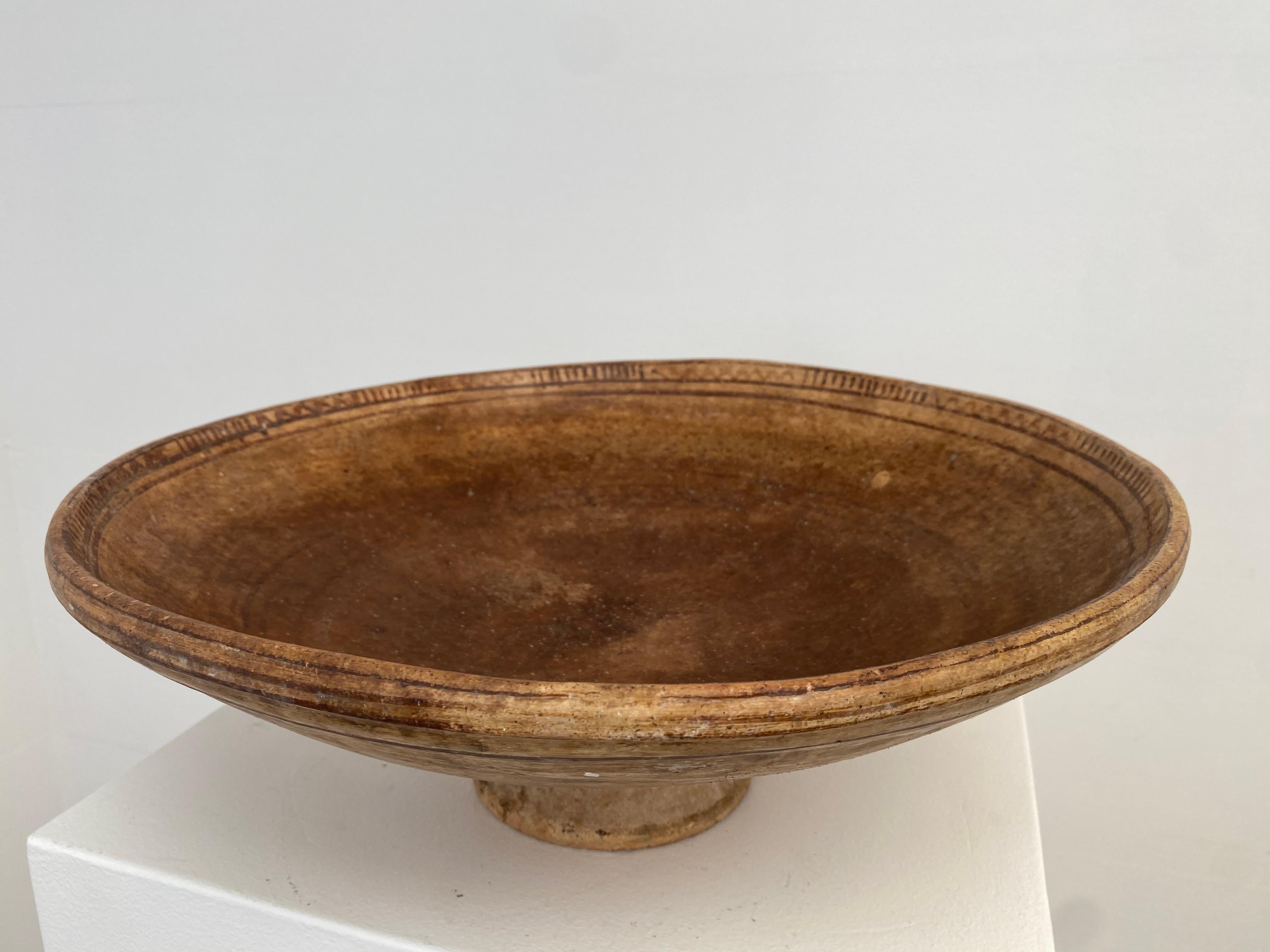 Beautiful,antique Berber Terracotta Tazza on a central foot,
beautiful Brown and beige colors and a good old patina and shine 
of the Terracotta, faded elegant decorations,
a very decorative object to be used for different purposes 