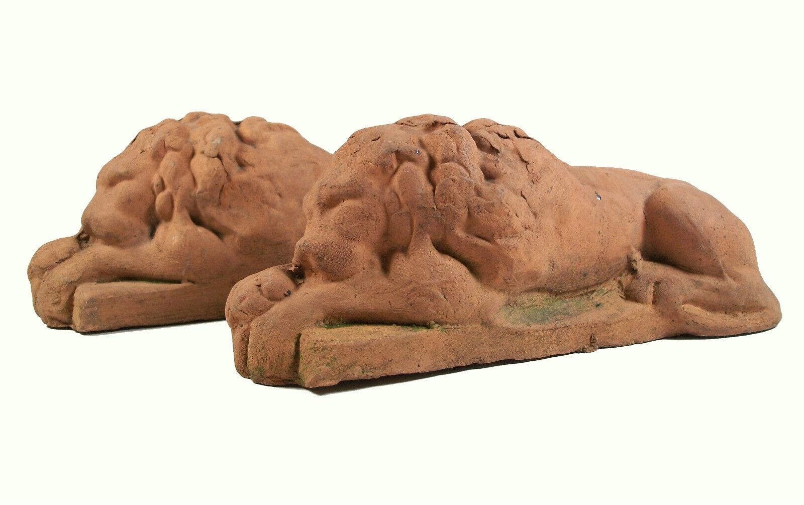 Antique pair of Neoclassical style terracotta recumbent lions - unsigned - Continental - late 19th/early 20th century.

The over-all condition of this pair of pre-owned antique items is excellent - no loss - no damage - no repairs - surface grime