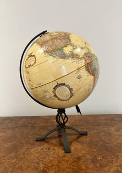 Antique terrestrial globe on a metal stand