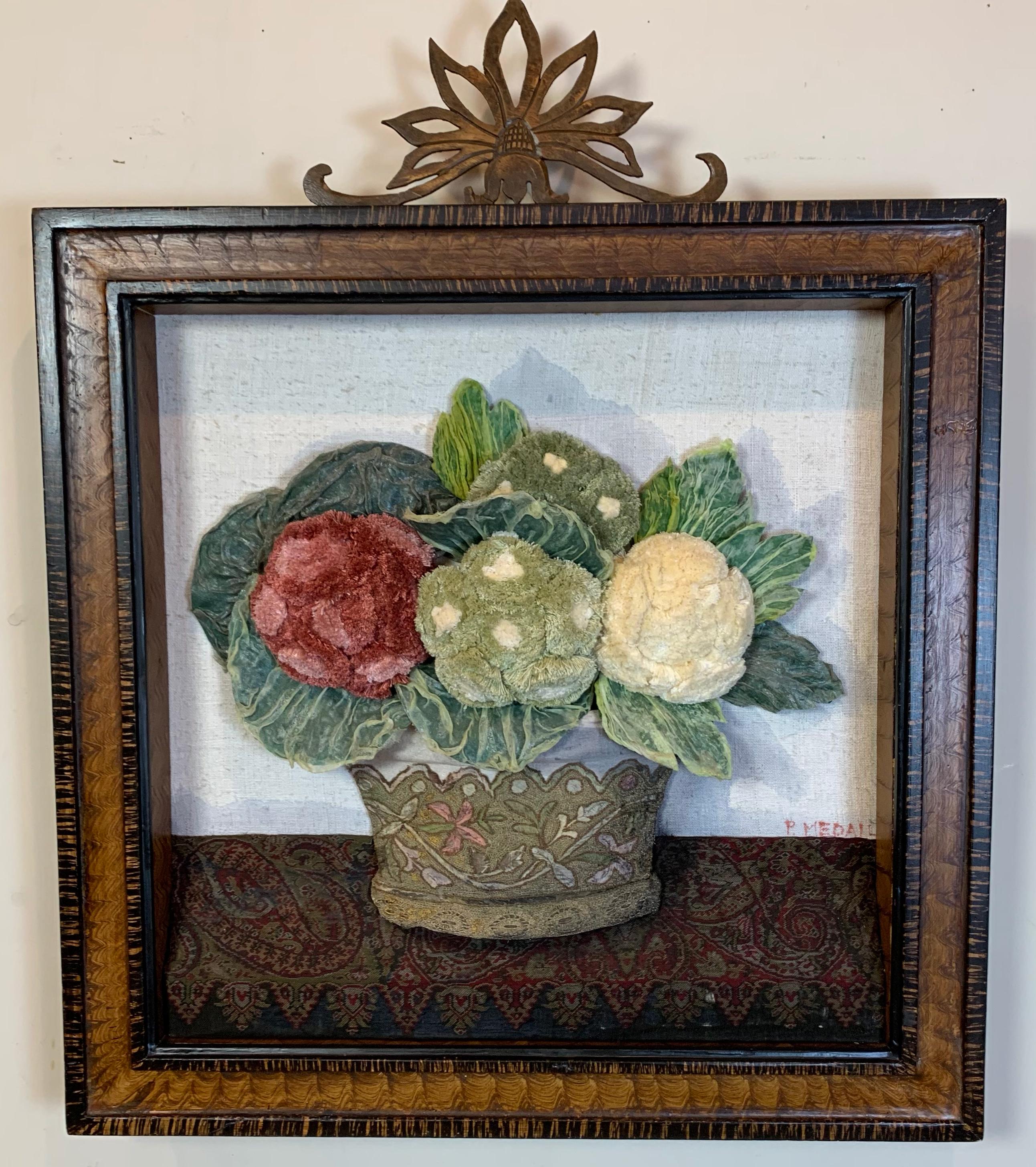 A large collage by noted textile artist, Patrizia Medail, of Bologna, Italy. The artist uses antiques fabrics to created still life works of art. The piece is in it's original faux grained wood frame. Sold by the Stephanie Hoppen Gallery in London.