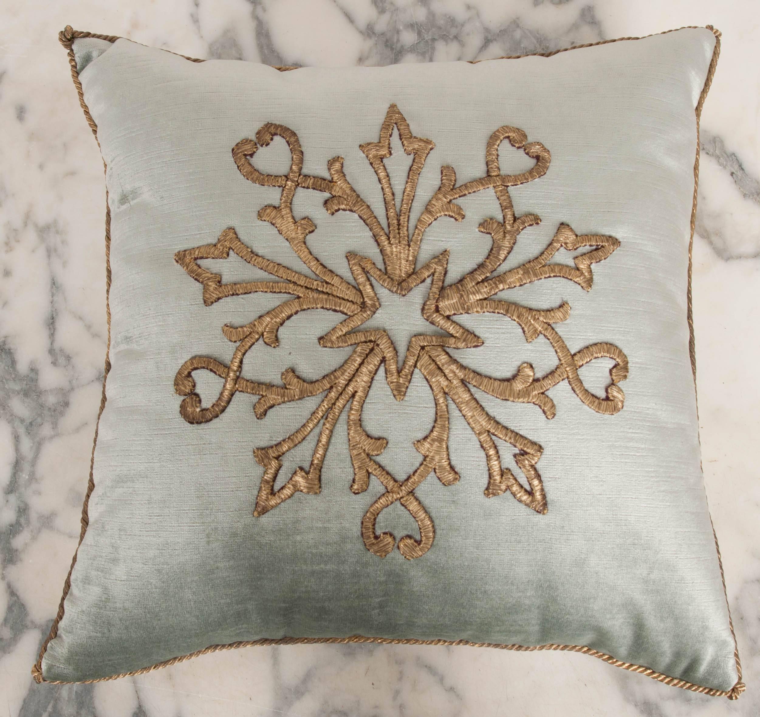 Antique Ottoman Empire raised gold metallic embroidery of a star with scrollwork on pale French blue velvet. Hand trimmed with vintage gold metallic cording knotted in the corners. Down filled.



