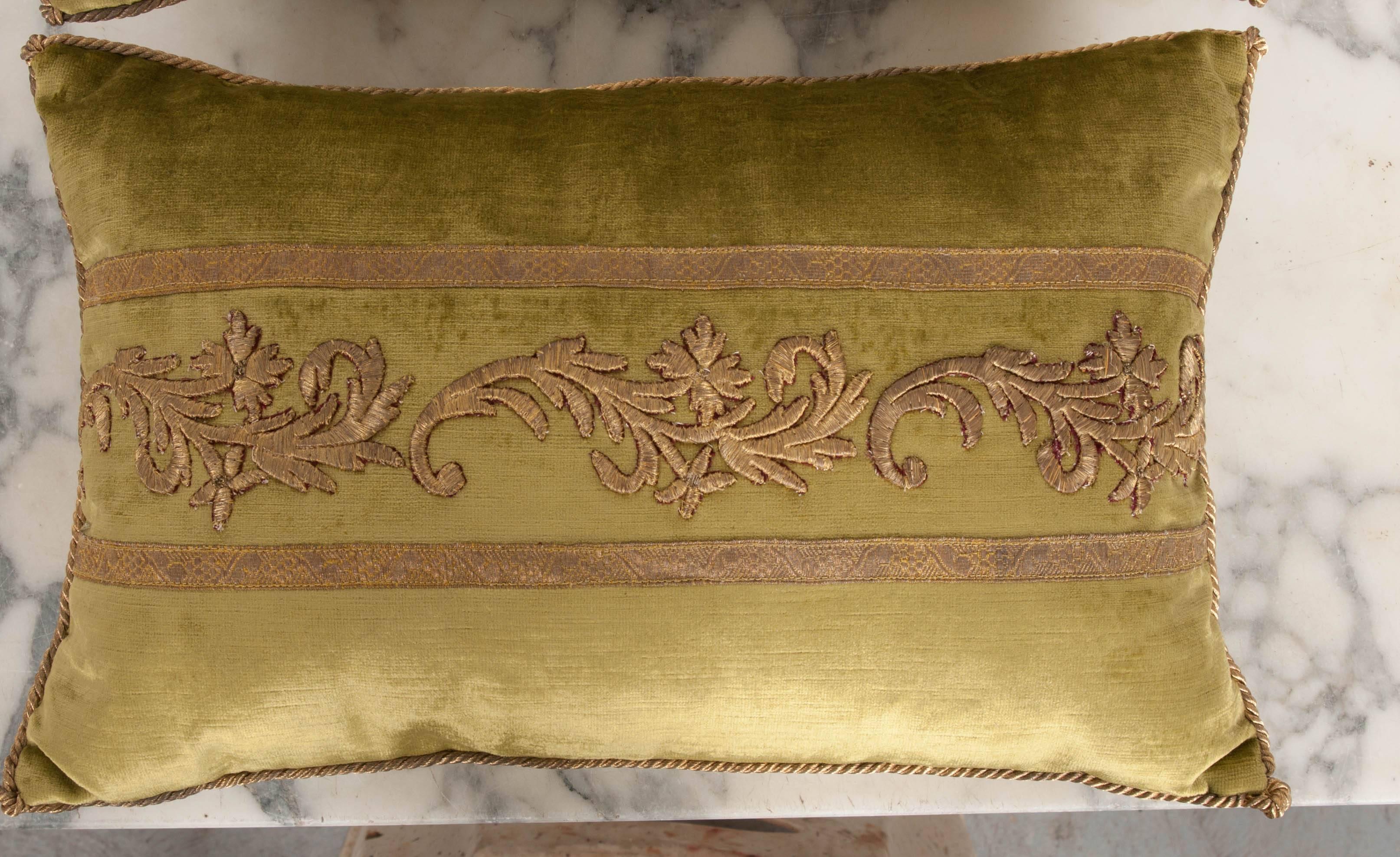 Antique ottoman Empire raised gold metallic embroidery bordered with antique gold metallic galon on chartreuse velvet. Hand trimmed with vintage gold metallic cording knotted in the corners. Down Filled. Available for individual purchase: