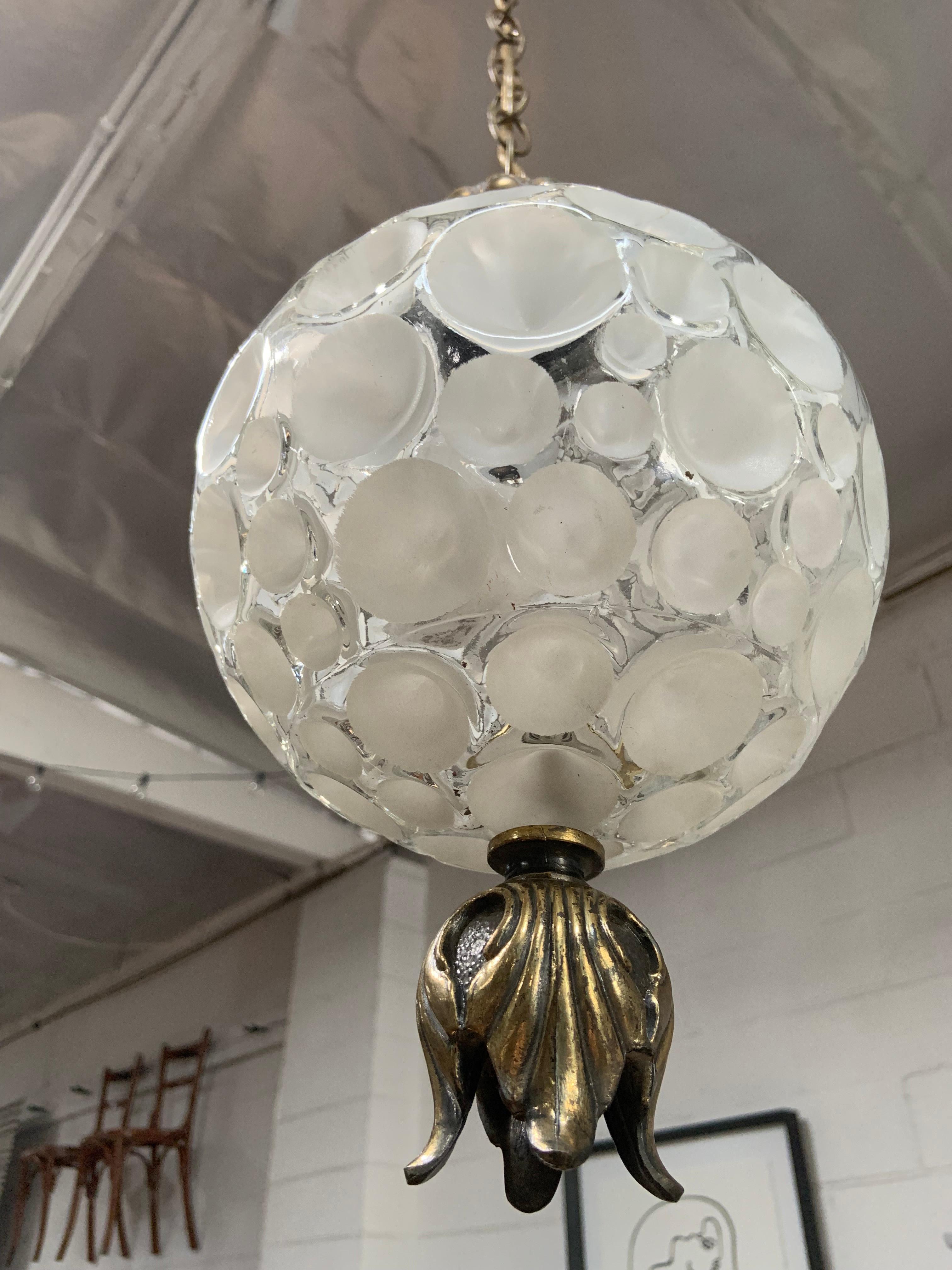 Vintage European pendant with textured glass that creates a unique look when lit. Brass fixture is original, unscrews to allow for cleaning and bulb removal. Takes standard bulbs.