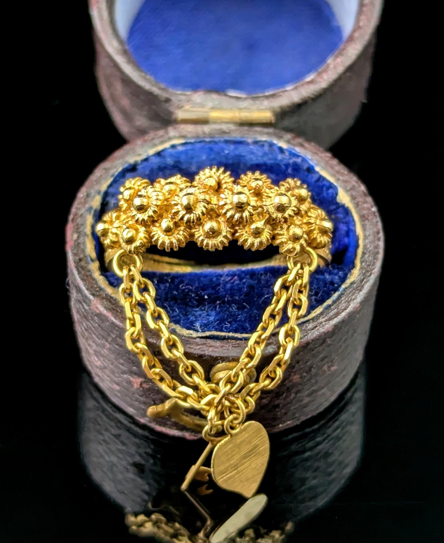 A gorgeous and sweet antique Sardinian textured band ring.

This beautiful piece is packed full of romance and sentiment with so much attention to detail!

Crafted in superbly rich 22ct yellow gold with a gilt wash it features a textured band with