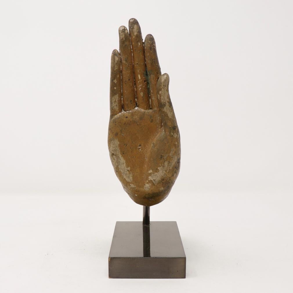 Antique Thai Bronze Hand Fragment, from a standing Buddha image in the abhaya mudra, the right hand which is open palm and extended forward in the absence of fear gesture. Elegant elongated fingers with the fingertips all curved slightly outward.