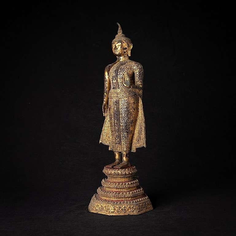 Material: bronze
55 cm high 
14,5 cm wide and 14,5 cm deep
Weight: 4.65 kgs
Gilded with 24 krt. gold
Abhaya mudra
Originating from Thailand
19th century - Rattanakosin period.
 